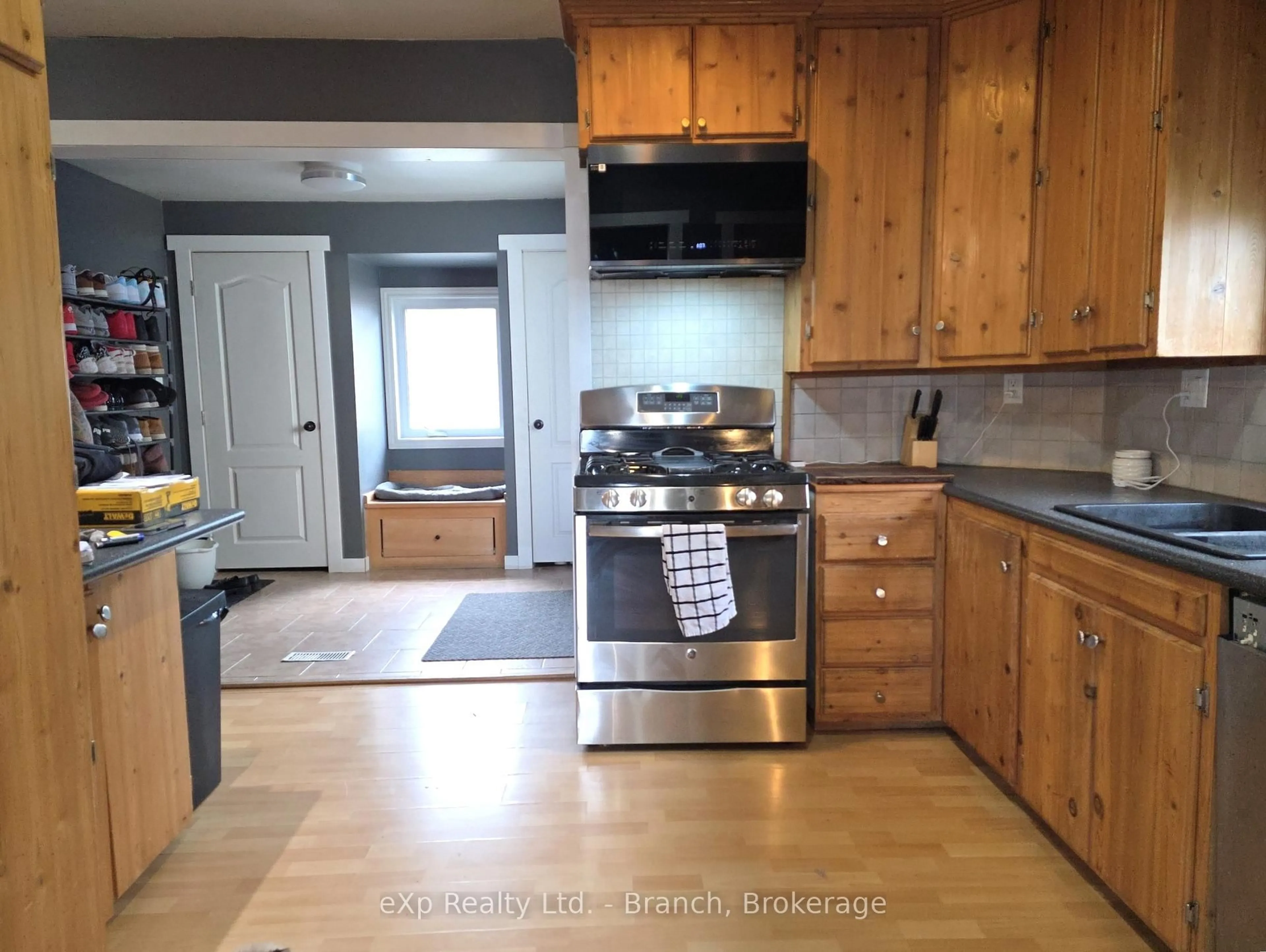 Open concept kitchen, wood/laminate floor for 120 Circle Pl, Iroquois Falls Ontario P0K 1E0