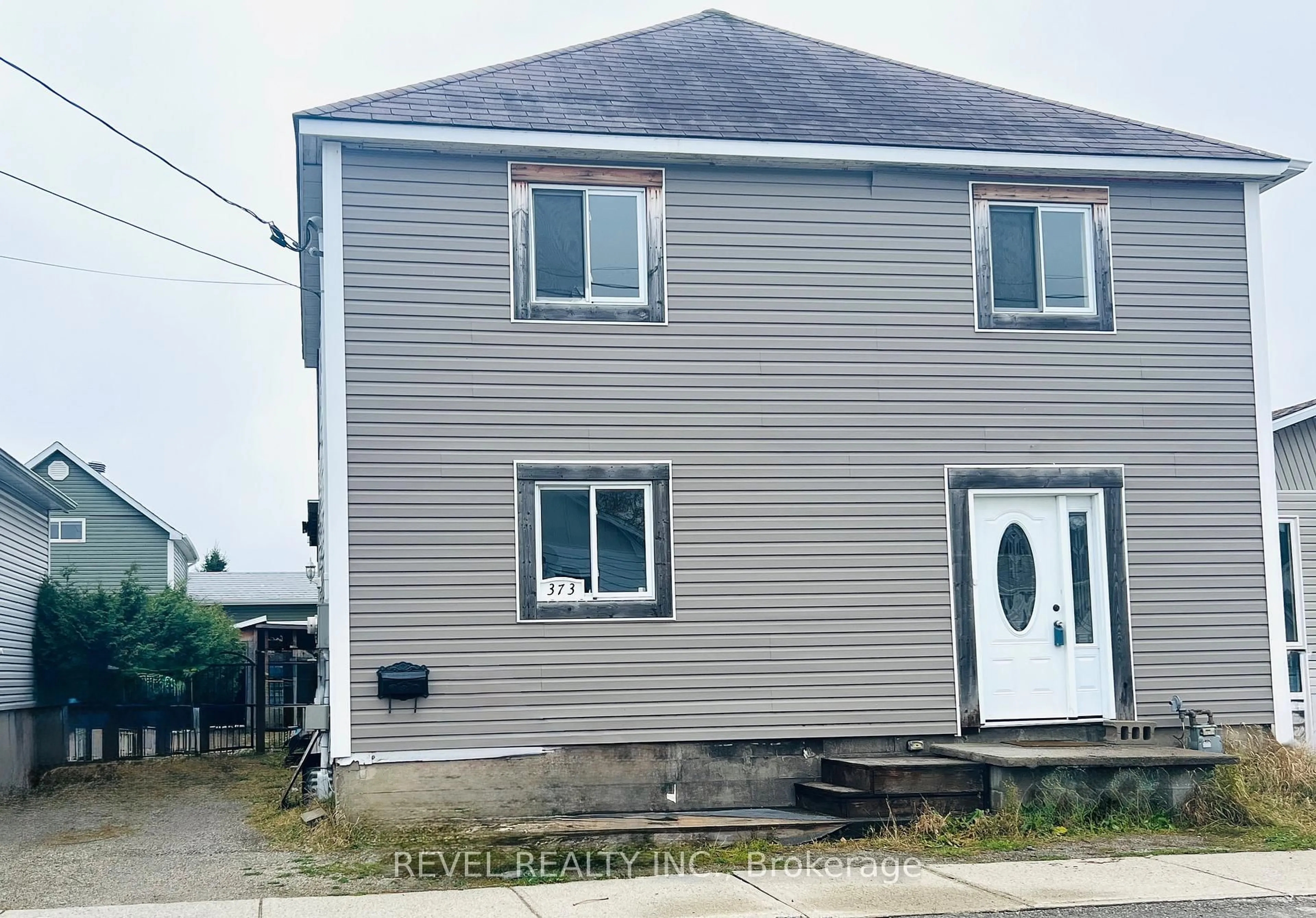 A pic from outside/outdoor area/front of a property/back of a property/a pic from drone, building for 373 Commercial Ave, Timmins Ontario P4N 2X8