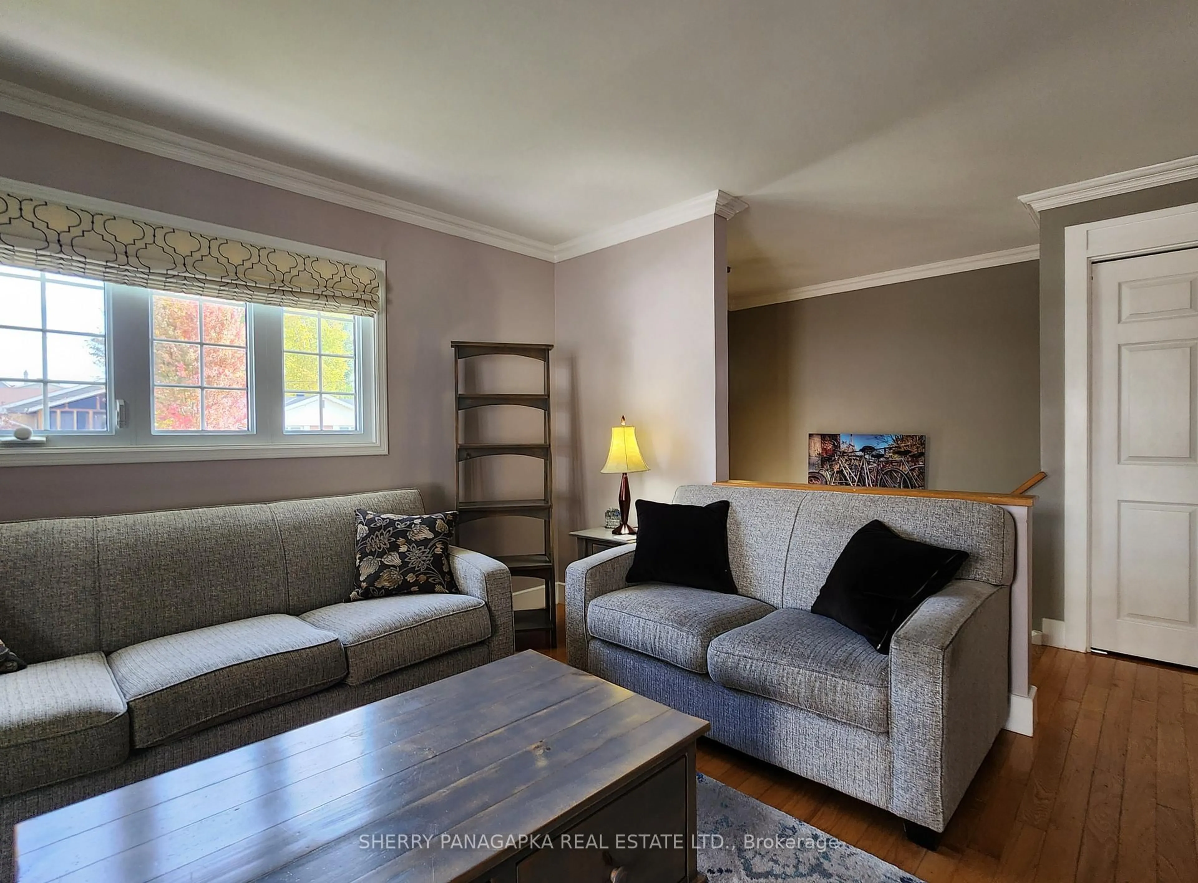 Living room with furniture, wood/laminate floor for 3 McPhee Ave, Kirkland Lake Ontario P2N 1M1