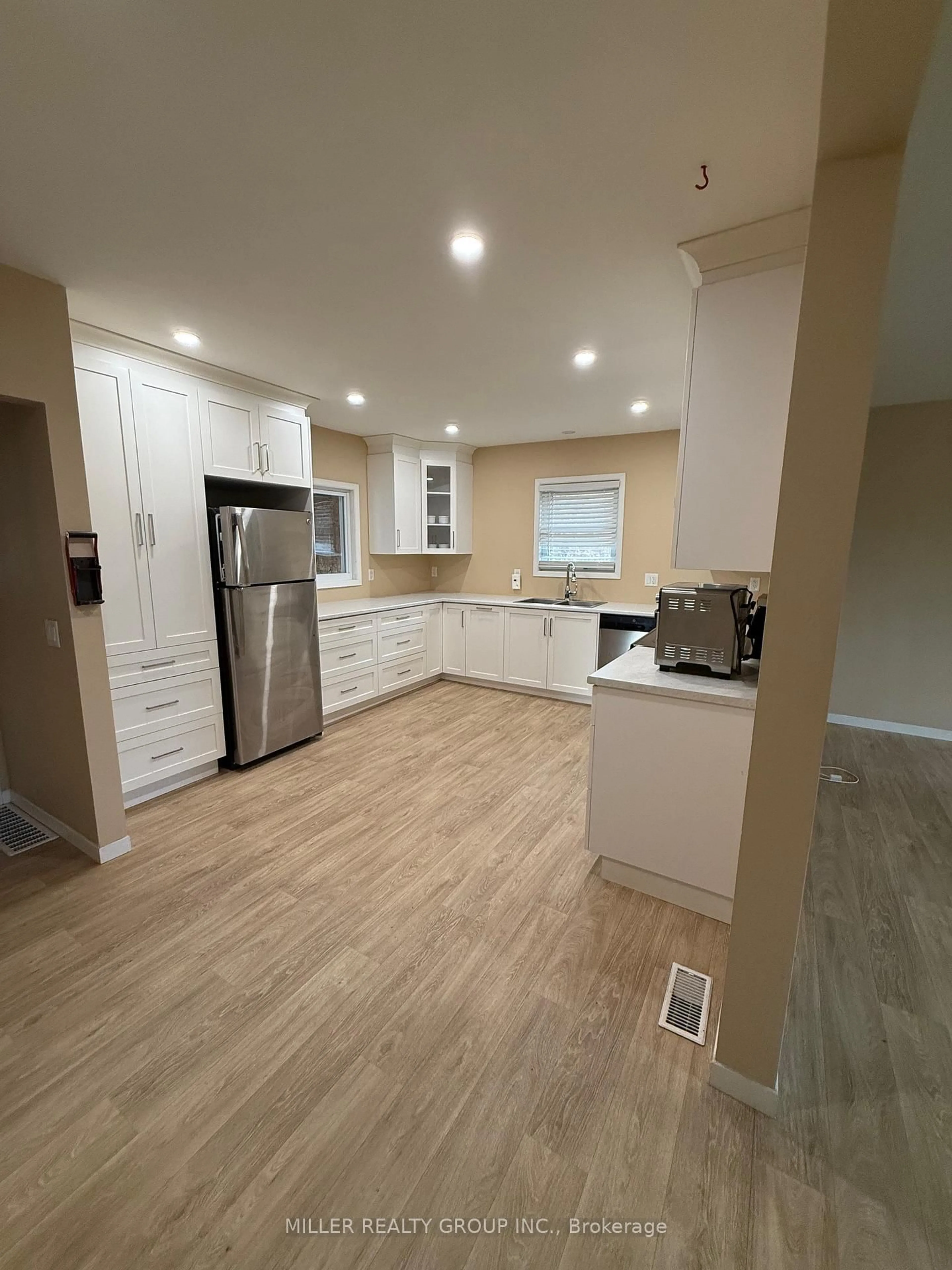 Open concept kitchen, wood/laminate floor for 88 Cobalt St, Cobalt Ontario P0J 1C0