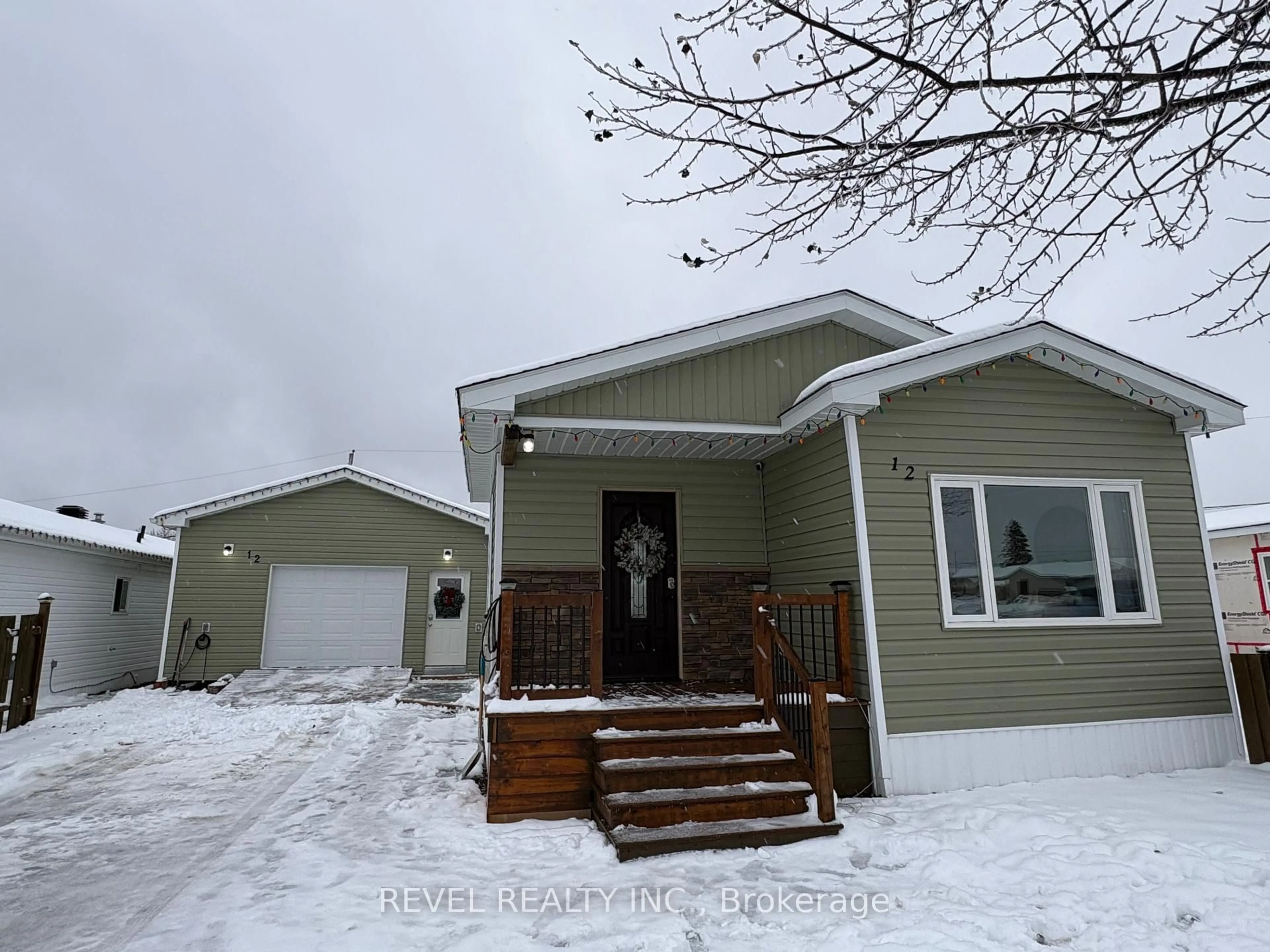 Home with vinyl exterior material, street for 12 Ford St, Cochrane Ontario P0L 1C0