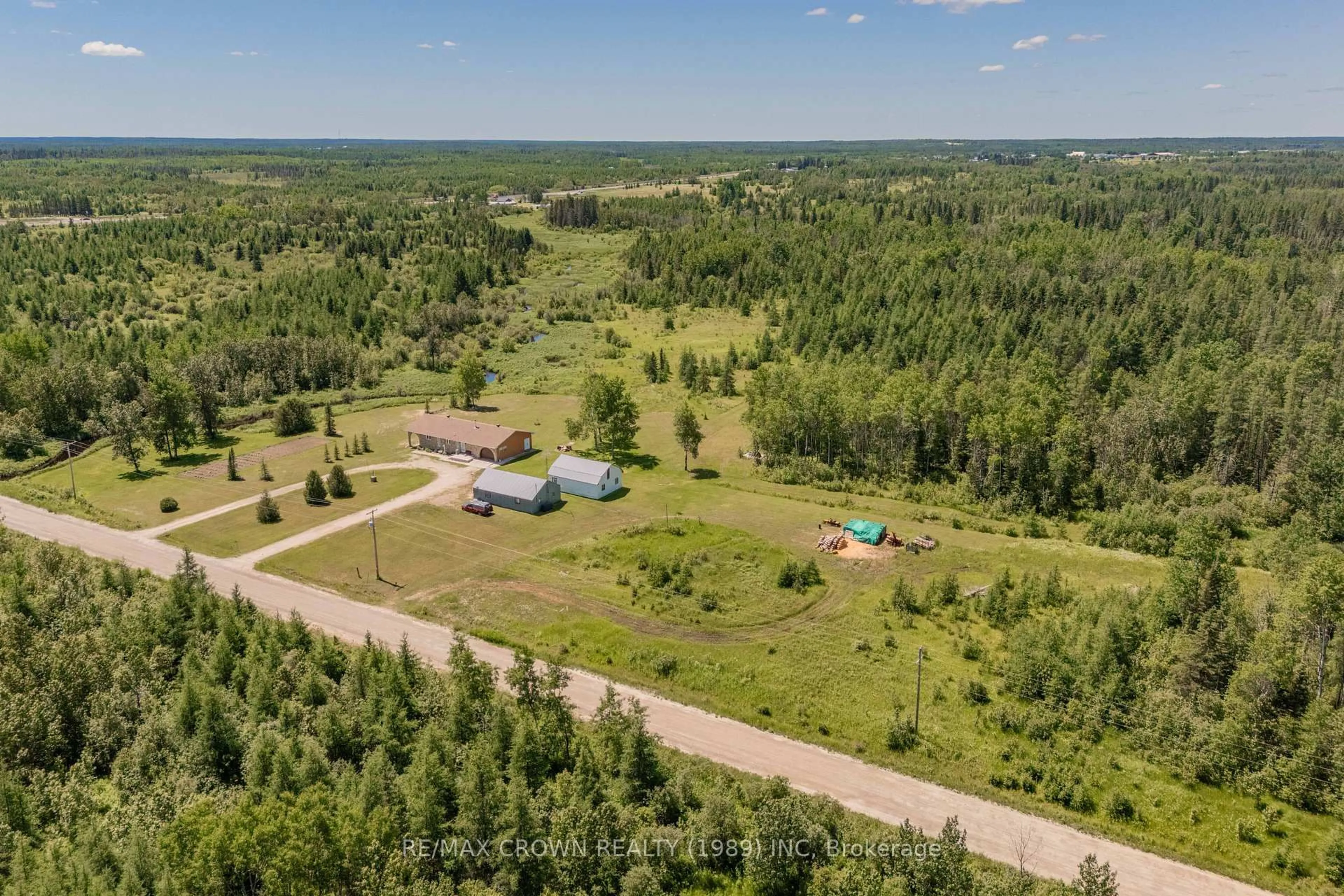A pic from outside/outdoor area/front of a property/back of a property/a pic from drone, forest/trees view for 3 Nursery Rd #Moonbeam, Kapuskasing Ontario P0L 1V0