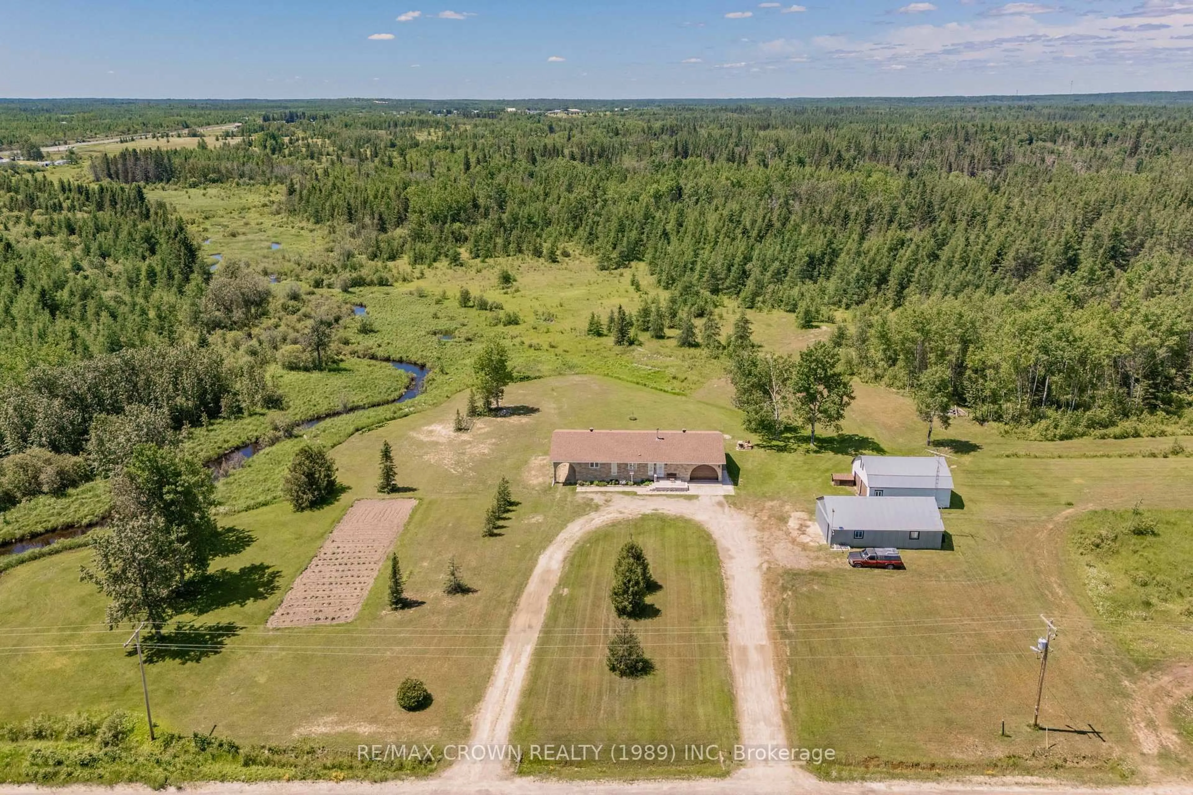 A pic from outside/outdoor area/front of a property/back of a property/a pic from drone, unknown for 3 Nursery Rd #Moonbeam, Kapuskasing Ontario P0L 1V0