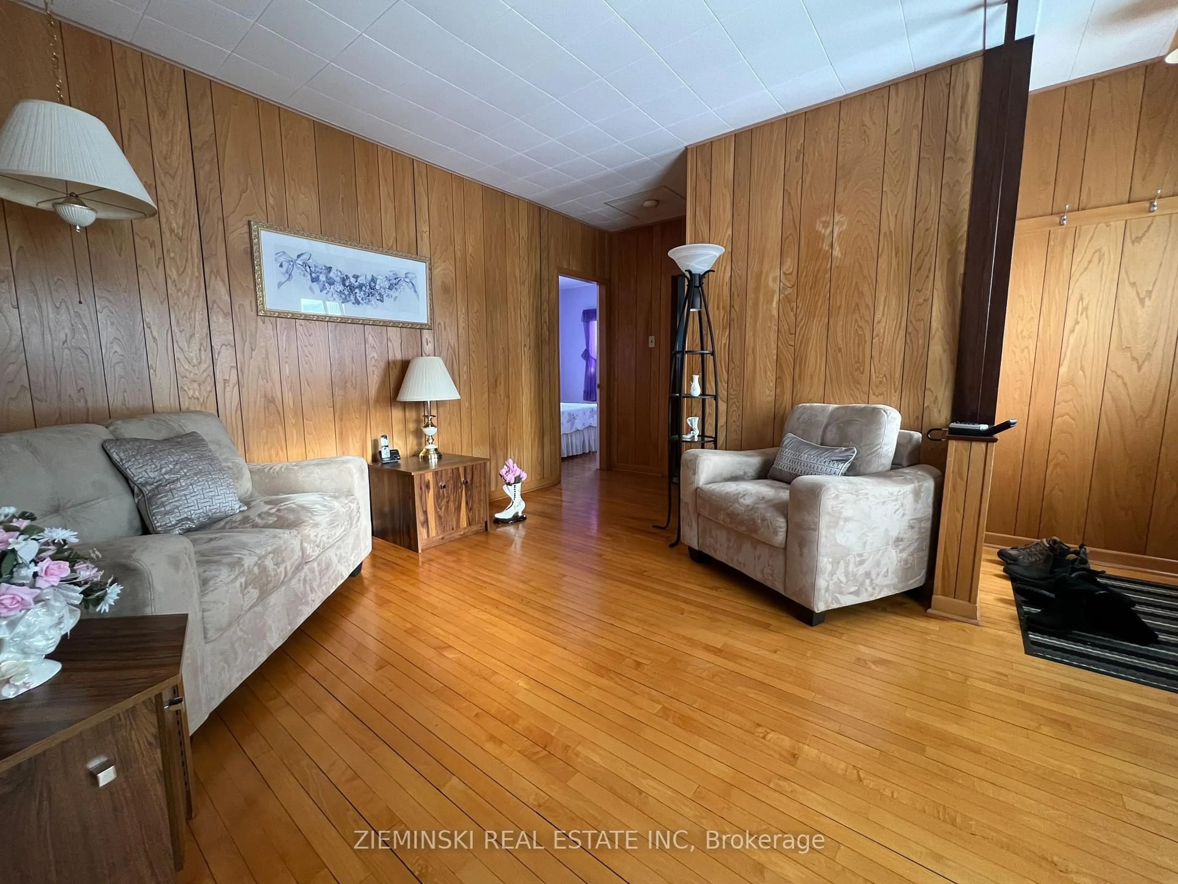 Living room with furniture, wood/laminate floor for 68 Second Ave, Smooth Rock Falls Ontario P0L 2B0