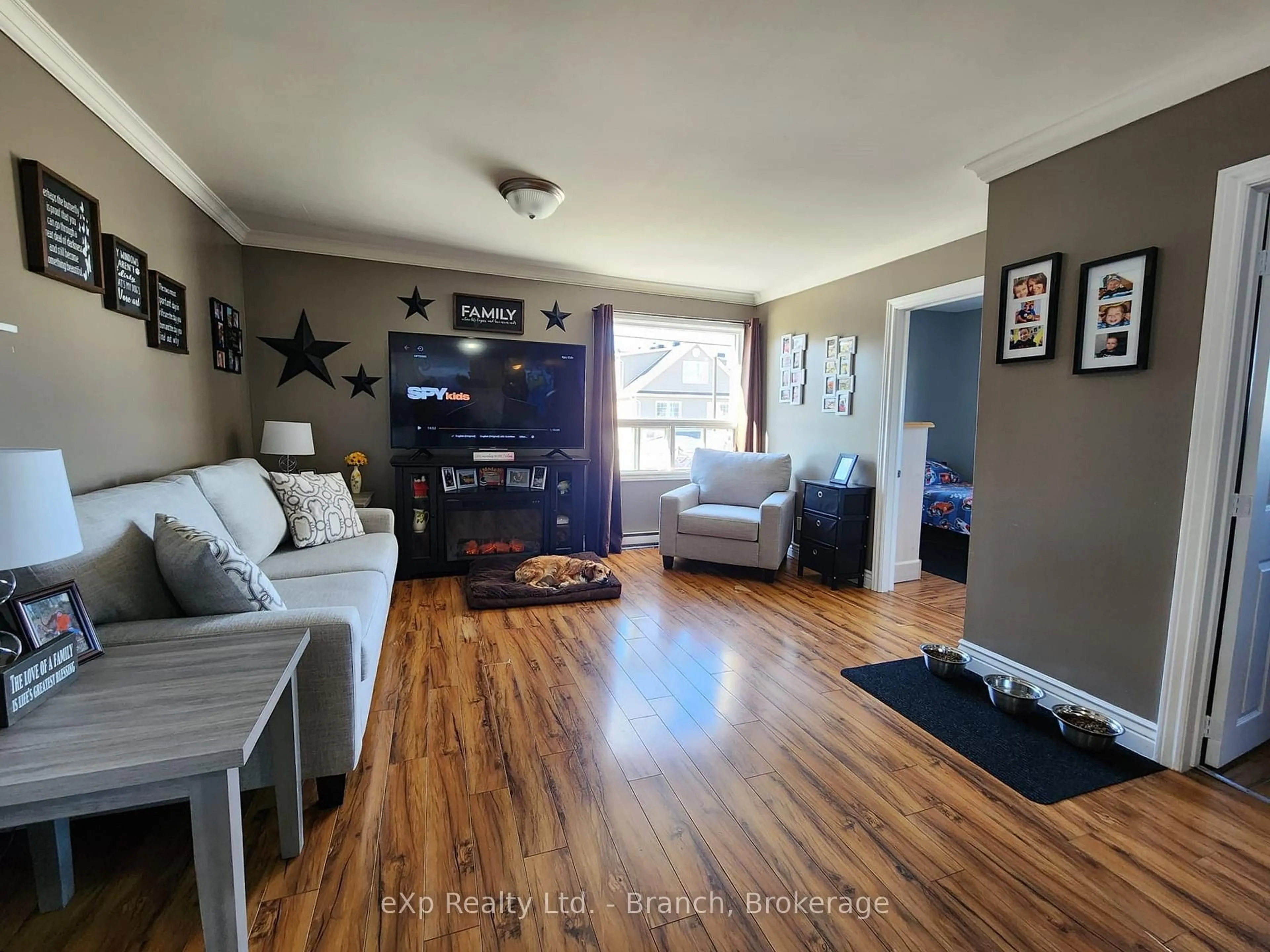 Living room with furniture, wood/laminate floor for 13 Main St, Kirkland Lake Ontario P2N 3C8