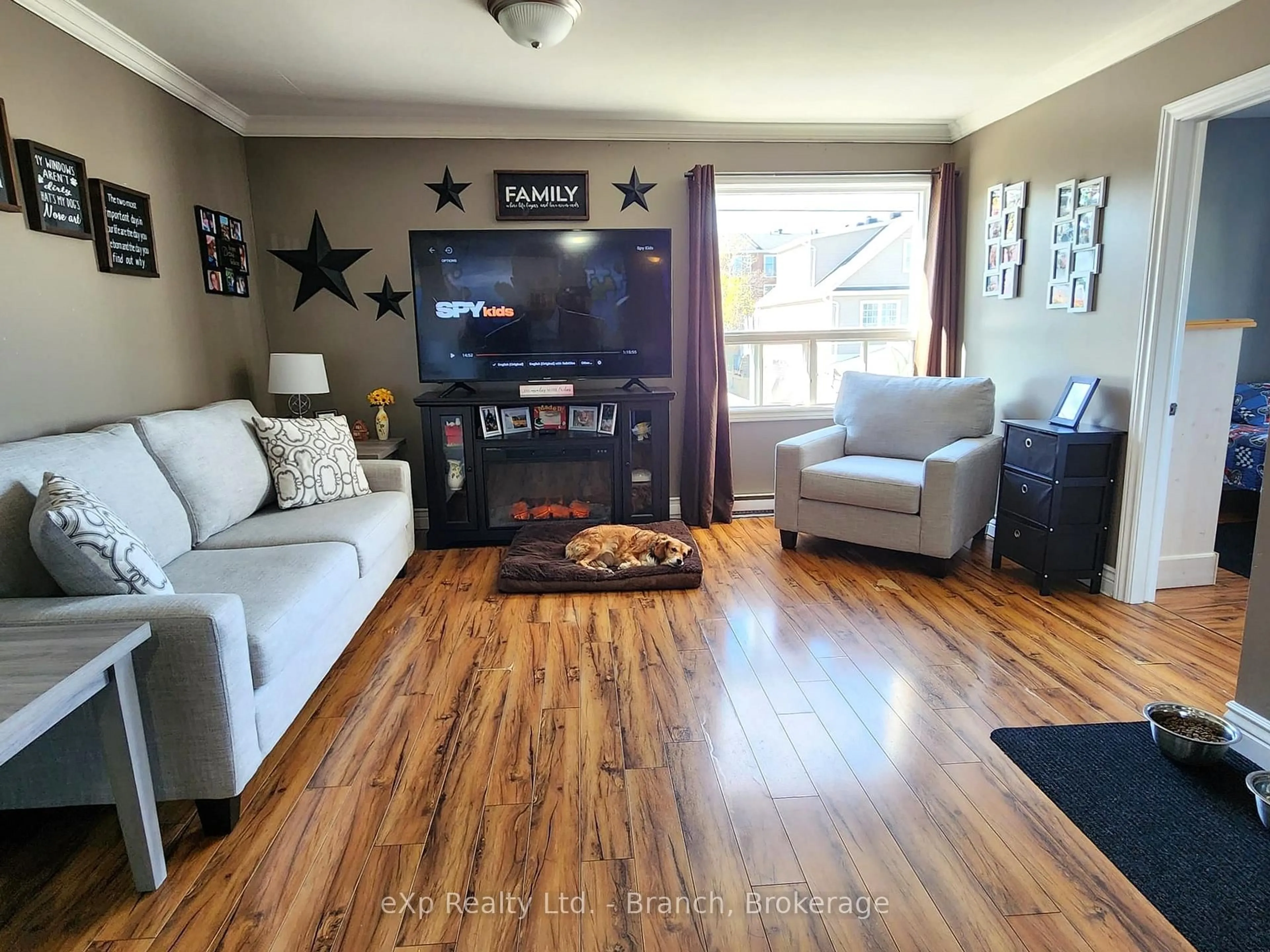 Living room with furniture, wood/laminate floor for 13 Main St, Kirkland Lake Ontario P2N 3C8