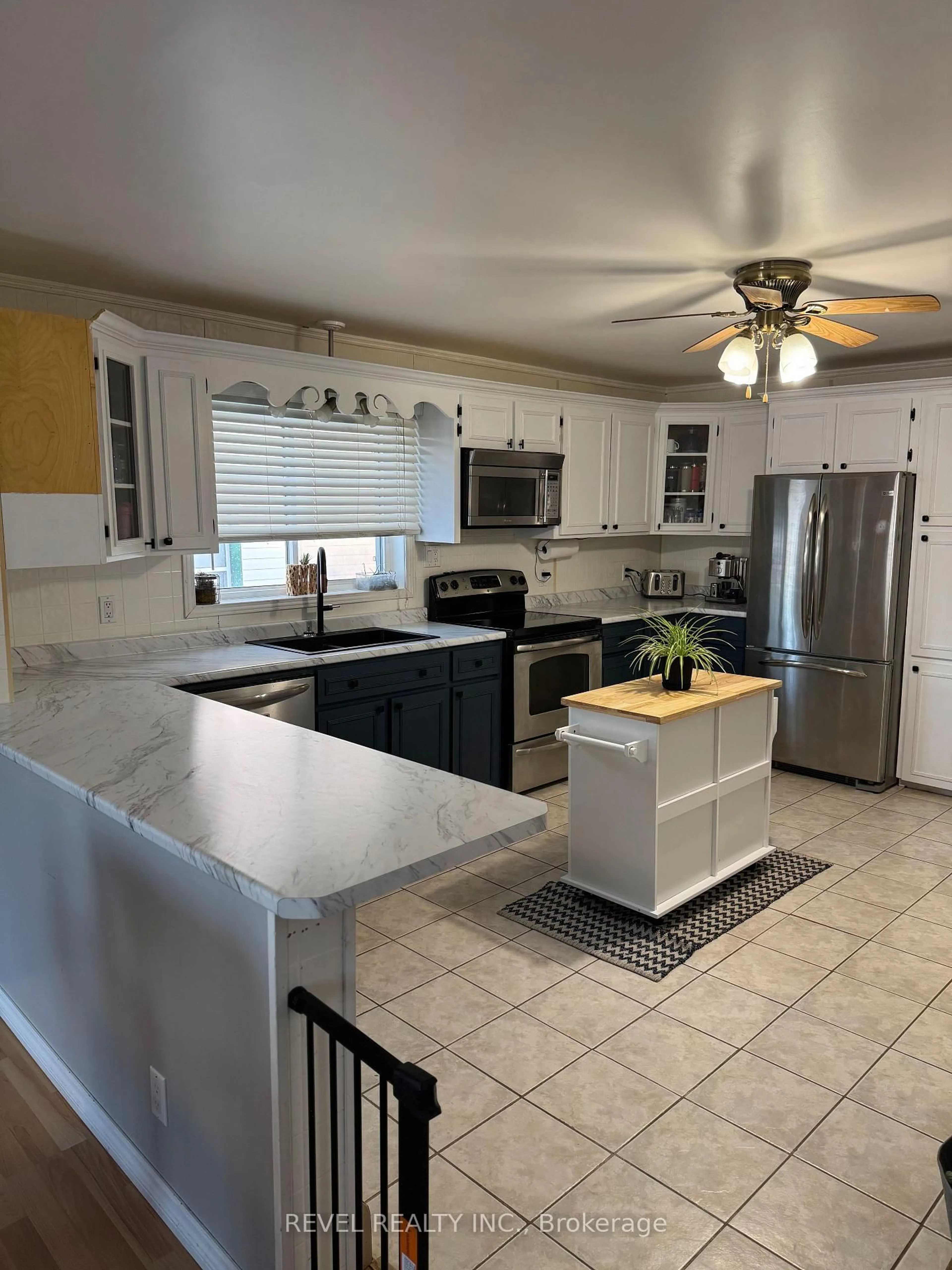 Open concept kitchen, ceramic/tile floor for 351 Commercial Ave, Timmins Ontario P4N 2X8