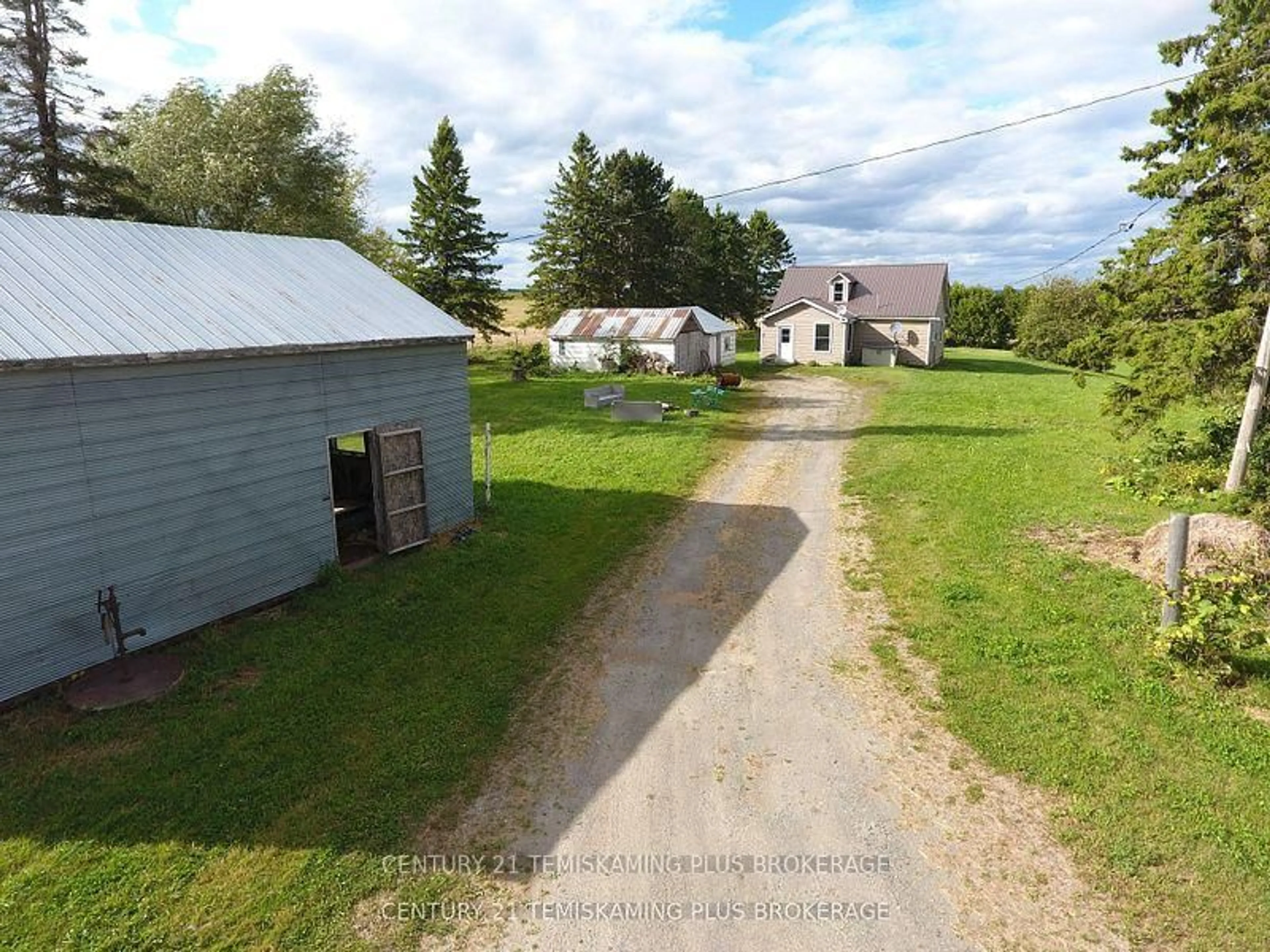 A pic from outside/outdoor area/front of a property/back of a property/a pic from drone, street for 253156 Roger's Rd, Englehart Ontario P0J 1H0