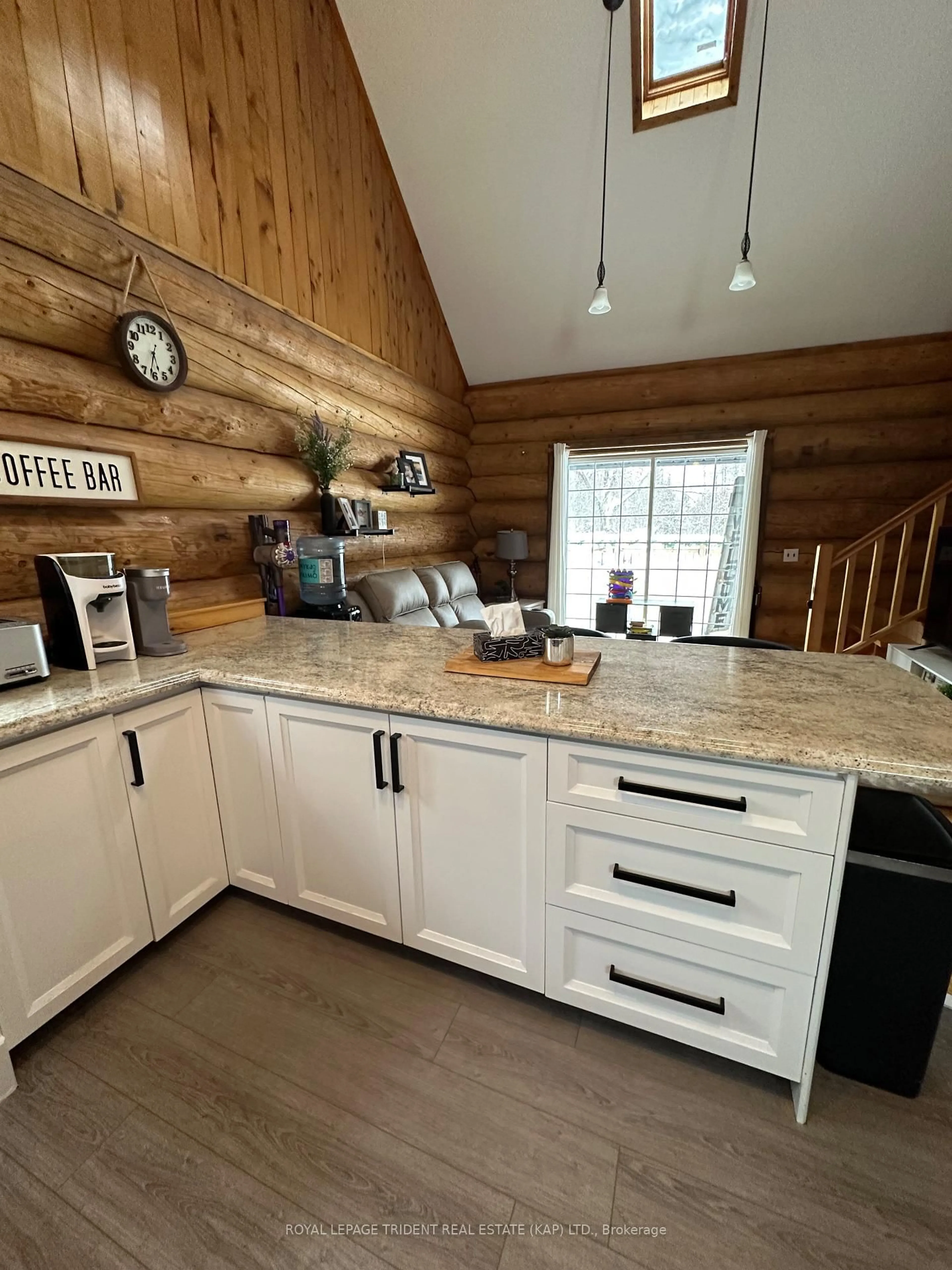 Open concept kitchen, wood/laminate floor for 127 Mitchell Rd, Kapuskasing Ontario P5N 2X8