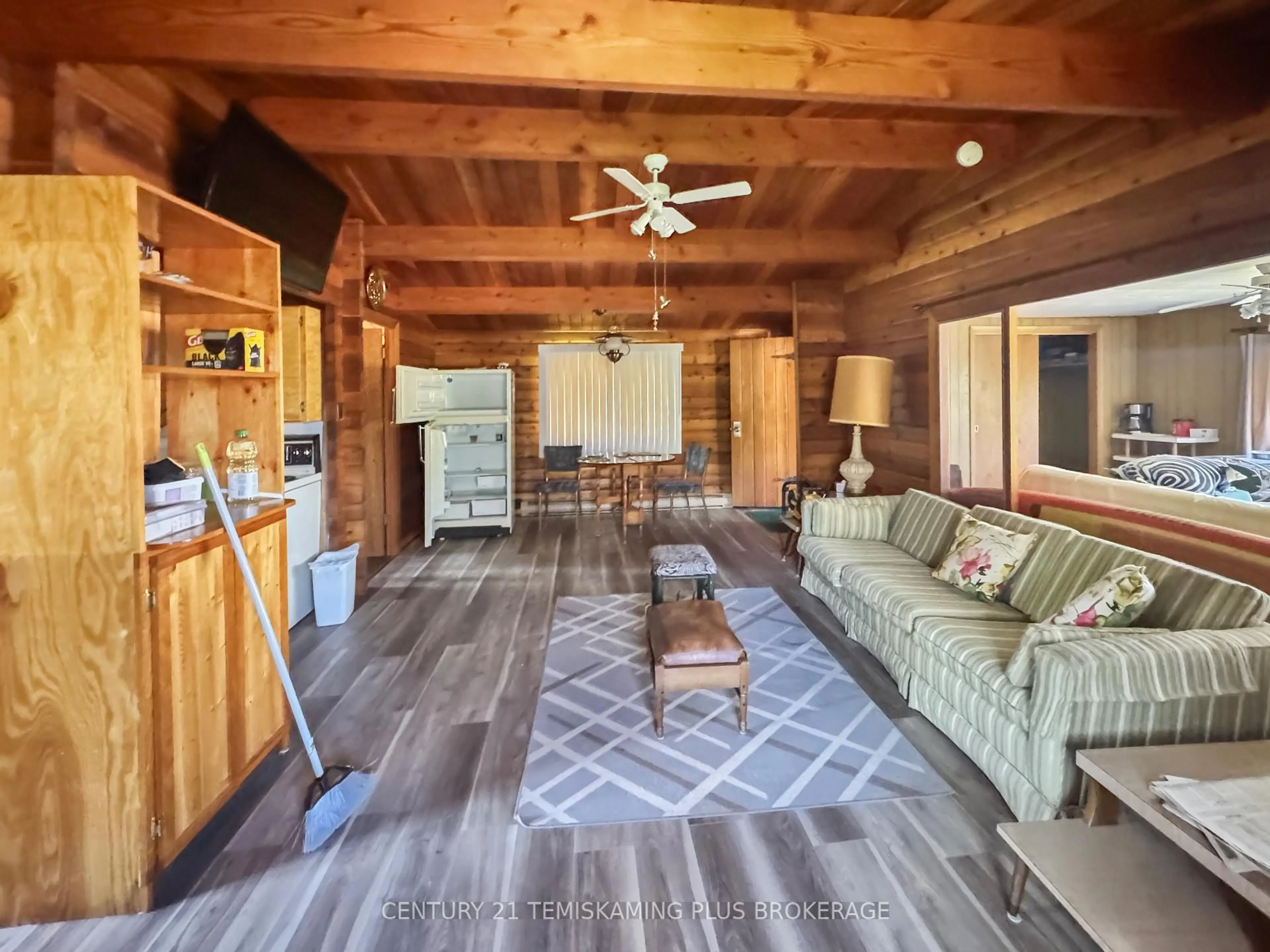 Living room with furniture, wood/laminate floor for 61 ONTARIO St, Timiskaming Ontario P0J 1G0