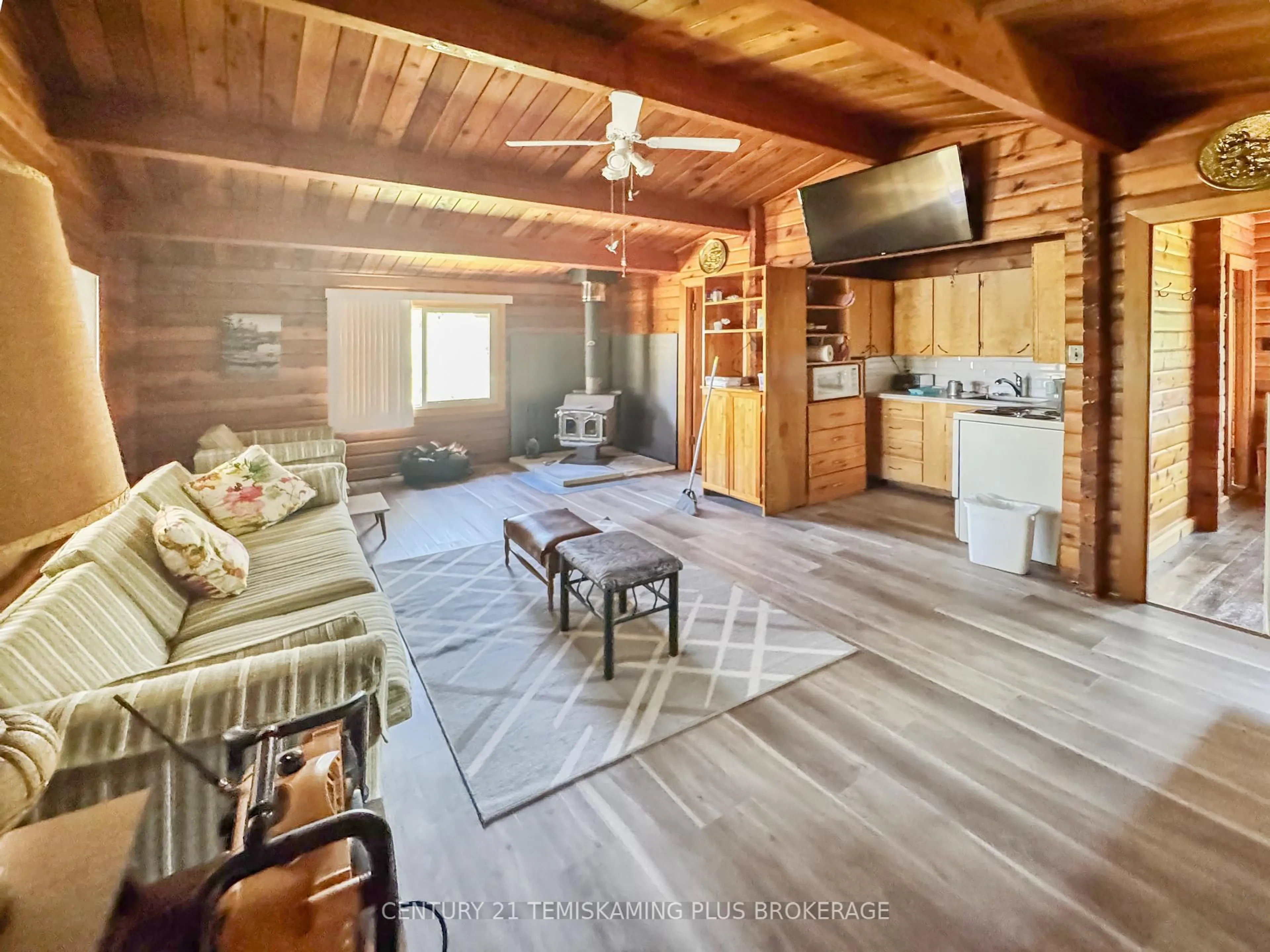 Living room with furniture, wood/laminate floor for 61 ONTARIO St, Timiskaming Ontario P0J 1G0