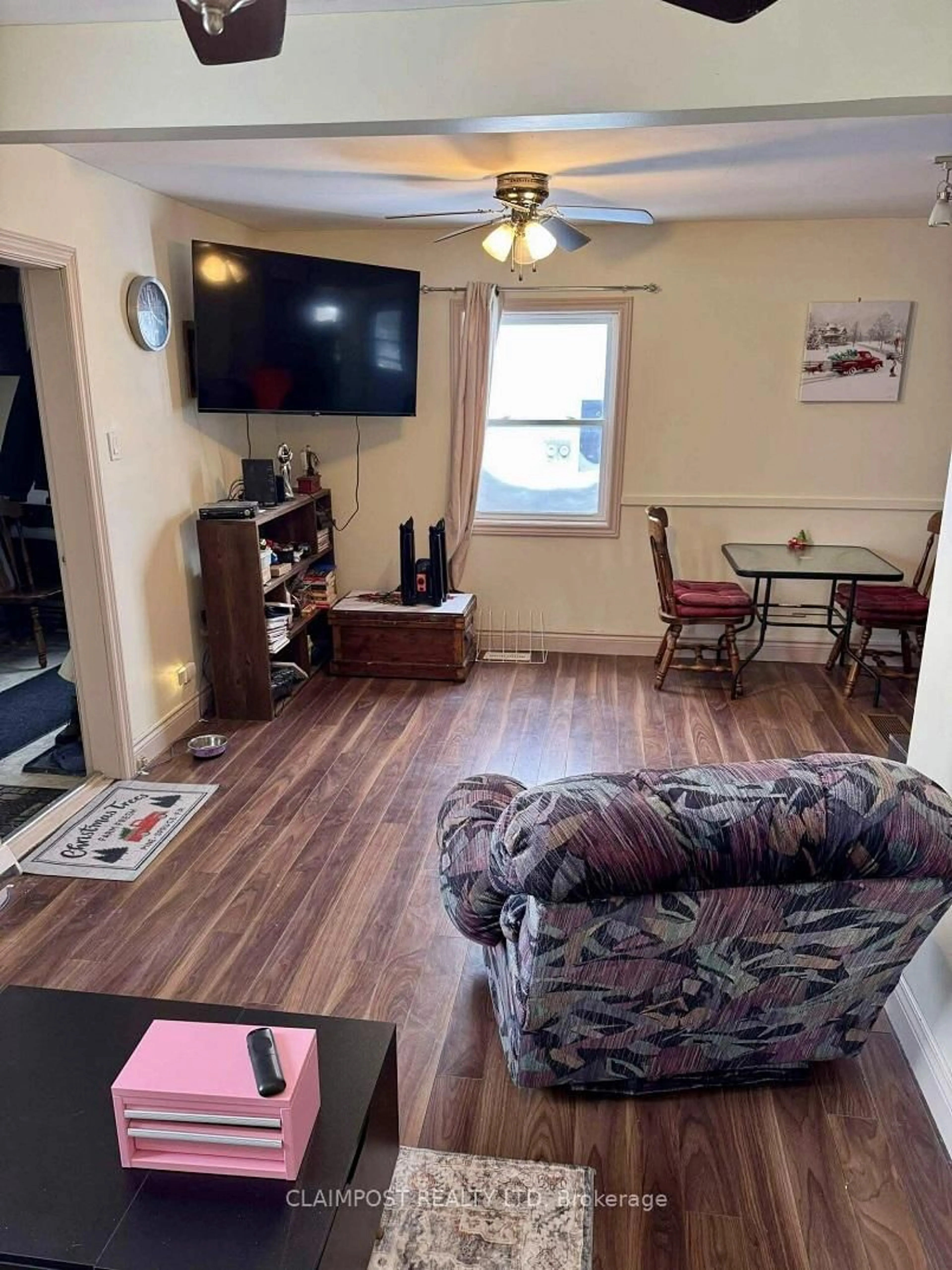 Living room with furniture, wood/laminate floor for 219 Wende Ave, Timmins Ontario P4N 3E6