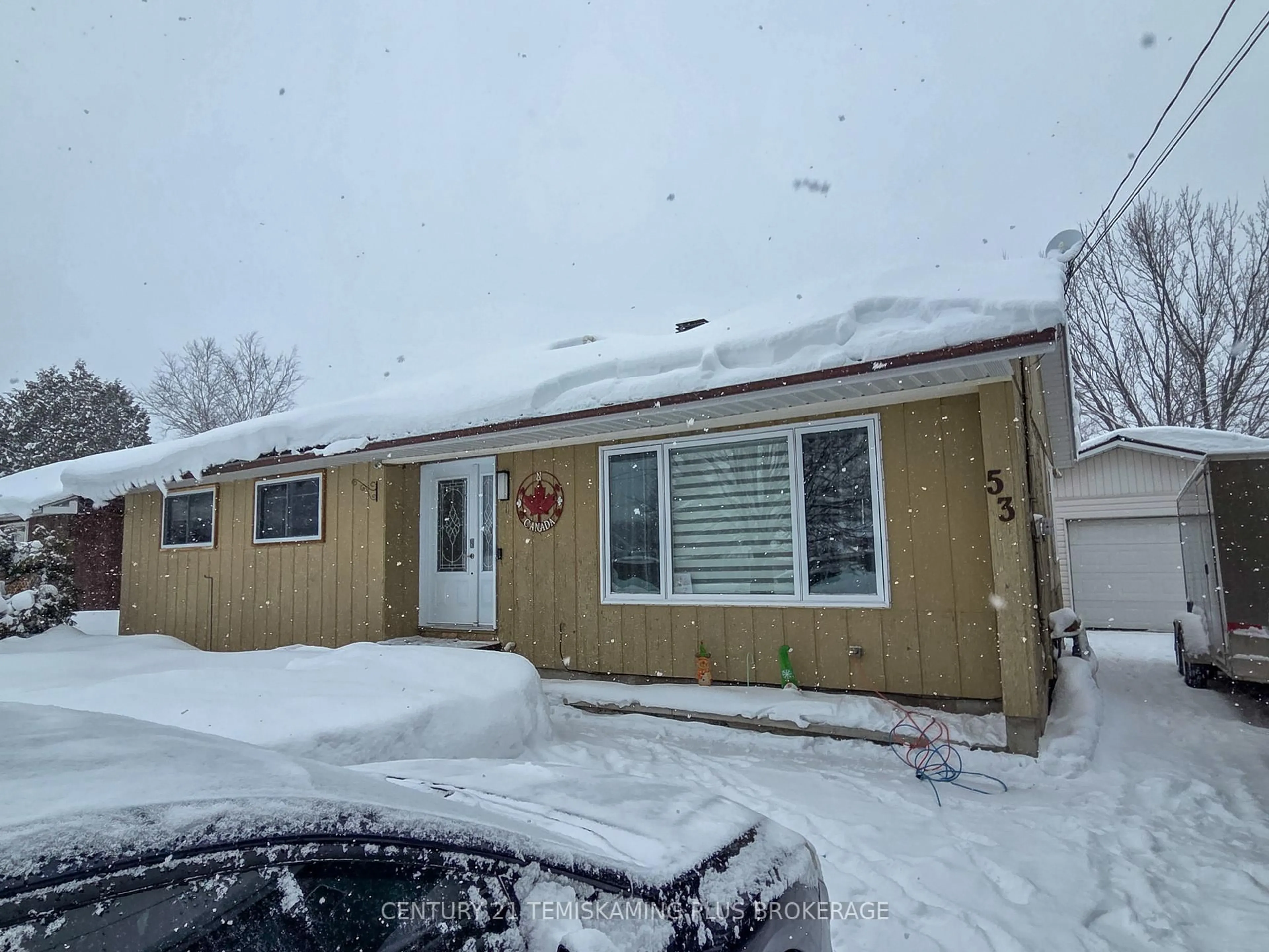 Home with vinyl exterior material, street for 53 Tenth Ave, Englehart Ontario P0J 1H0