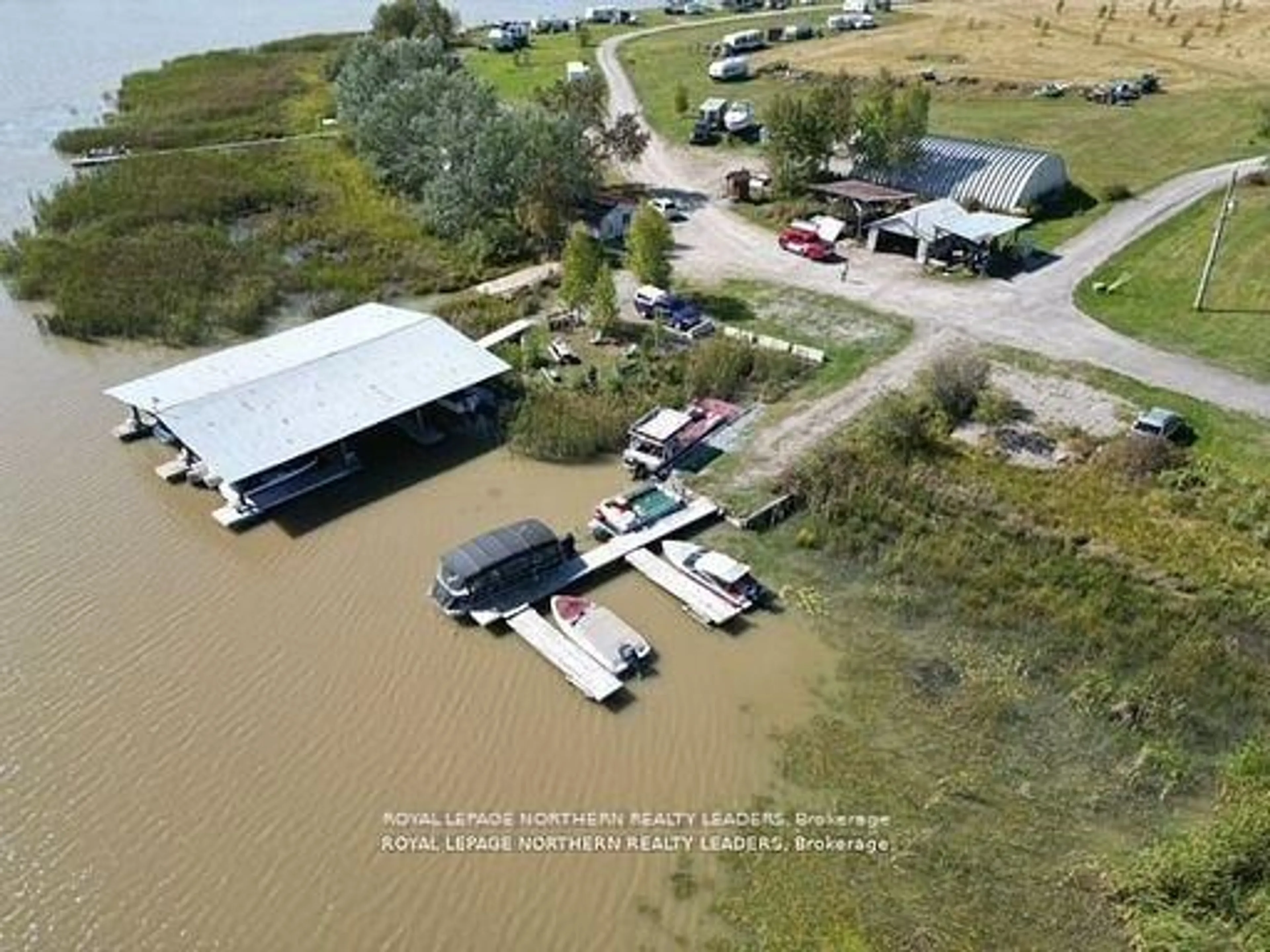 A pic from outside/outdoor area/front of a property/back of a property/a pic from drone, water/lake/river/ocean view for 13435 Highway 101, Timmins Ontario P0H 1A0