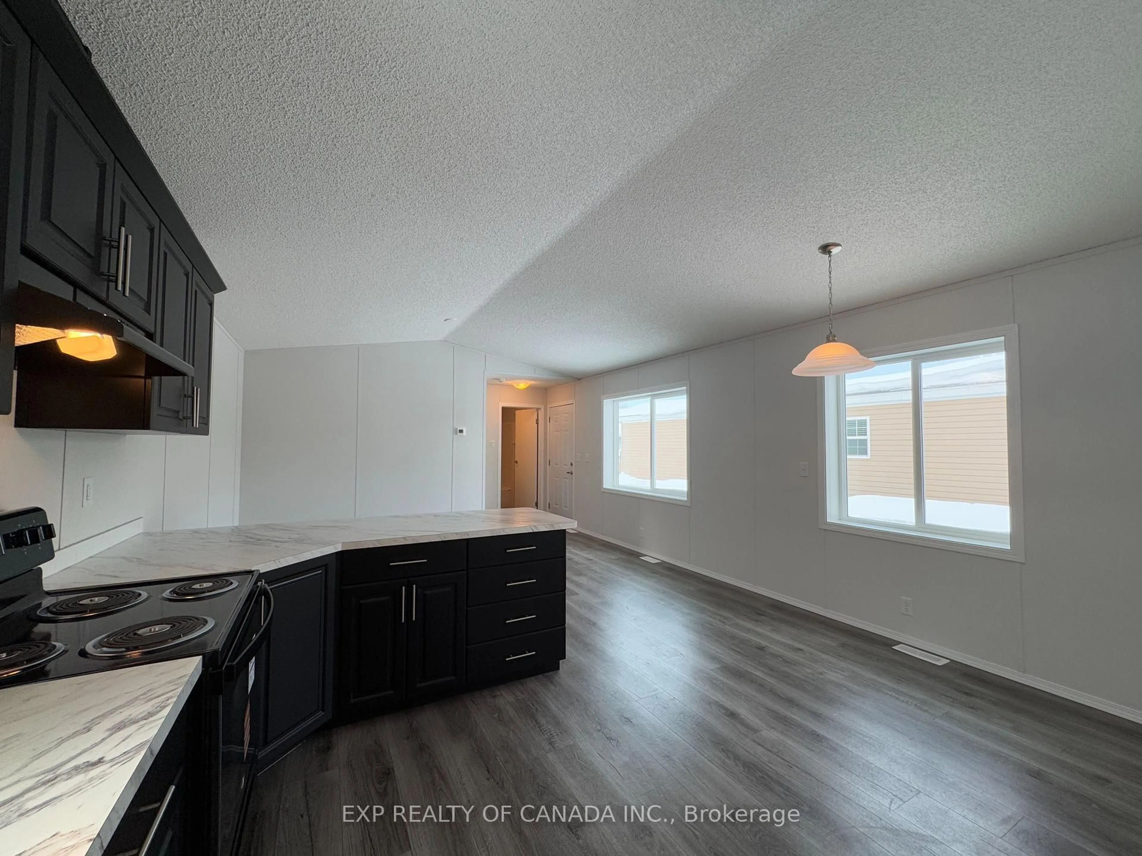 Open concept kitchen, wood/laminate floor for 188 Remi Cres, Timmins Ontario P4N 0C5