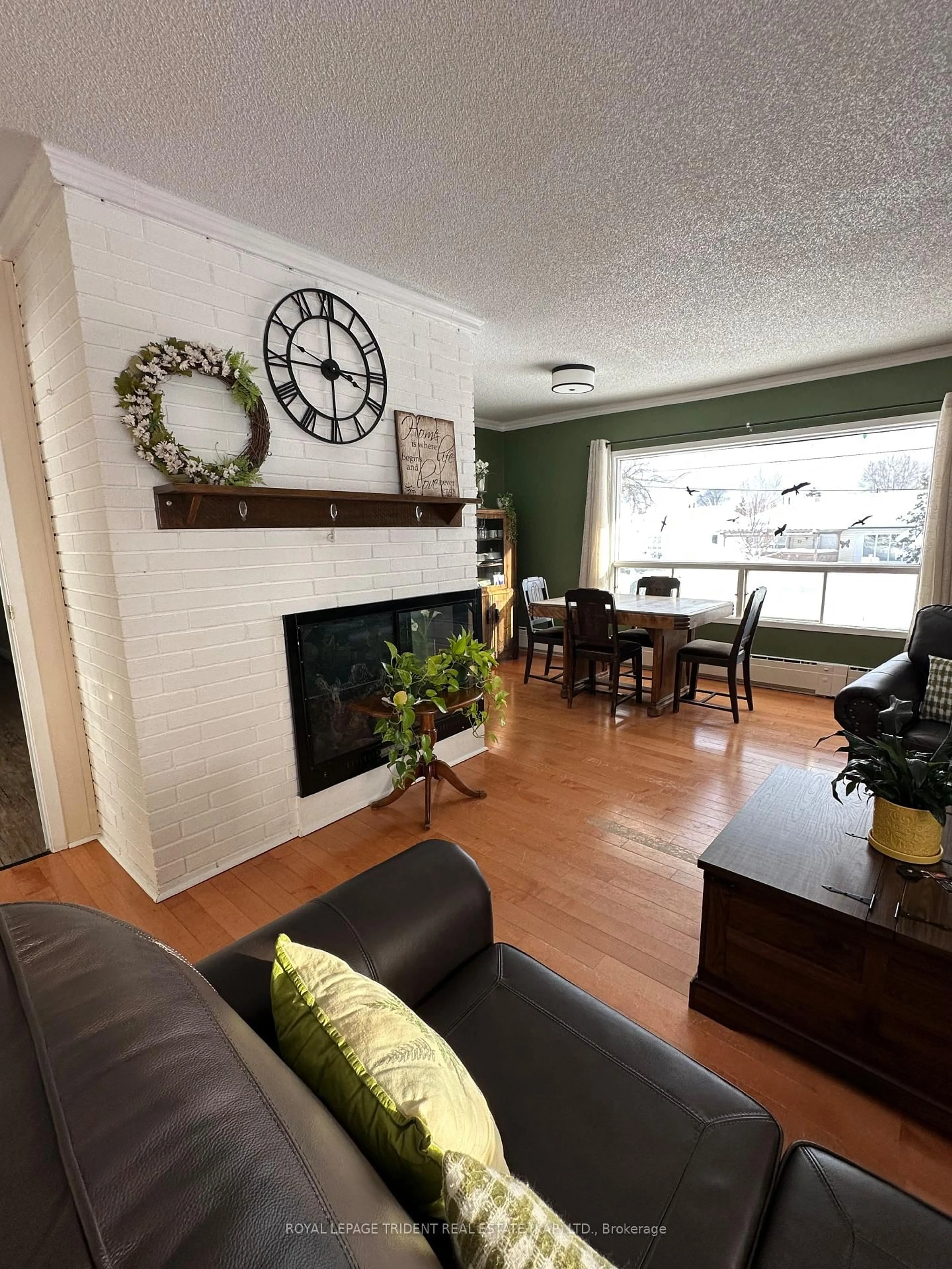Living room with furniture, wood/laminate floor for 1 Superior St, Kapuskasing Ontario P5N 2C3