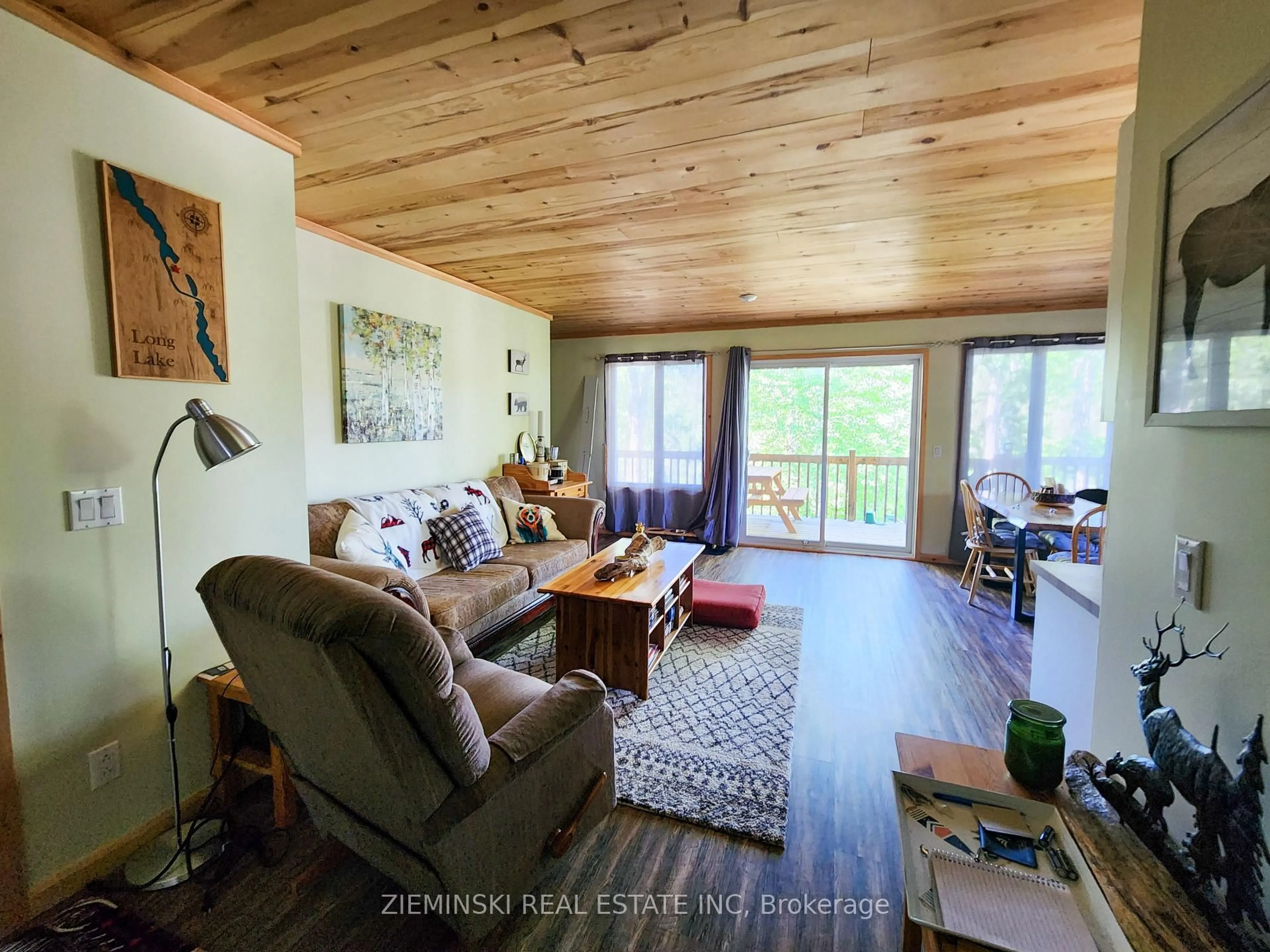 Living room with furniture, wood/laminate floor for 0 River Rd, Englehart Ontario P0J 1B0