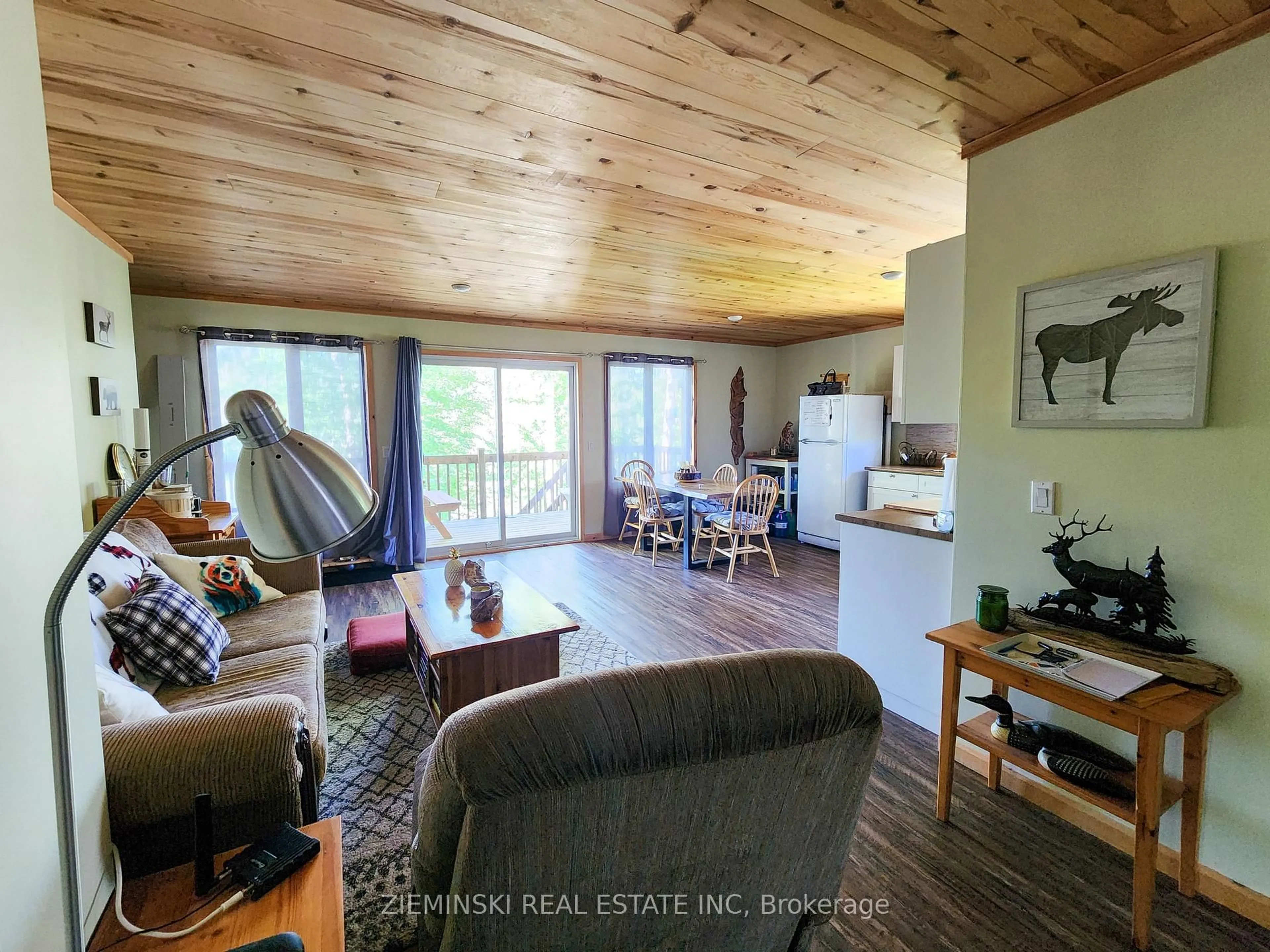 Living room with furniture, wood/laminate floor for 0 River Rd, Englehart Ontario P0J 1B0