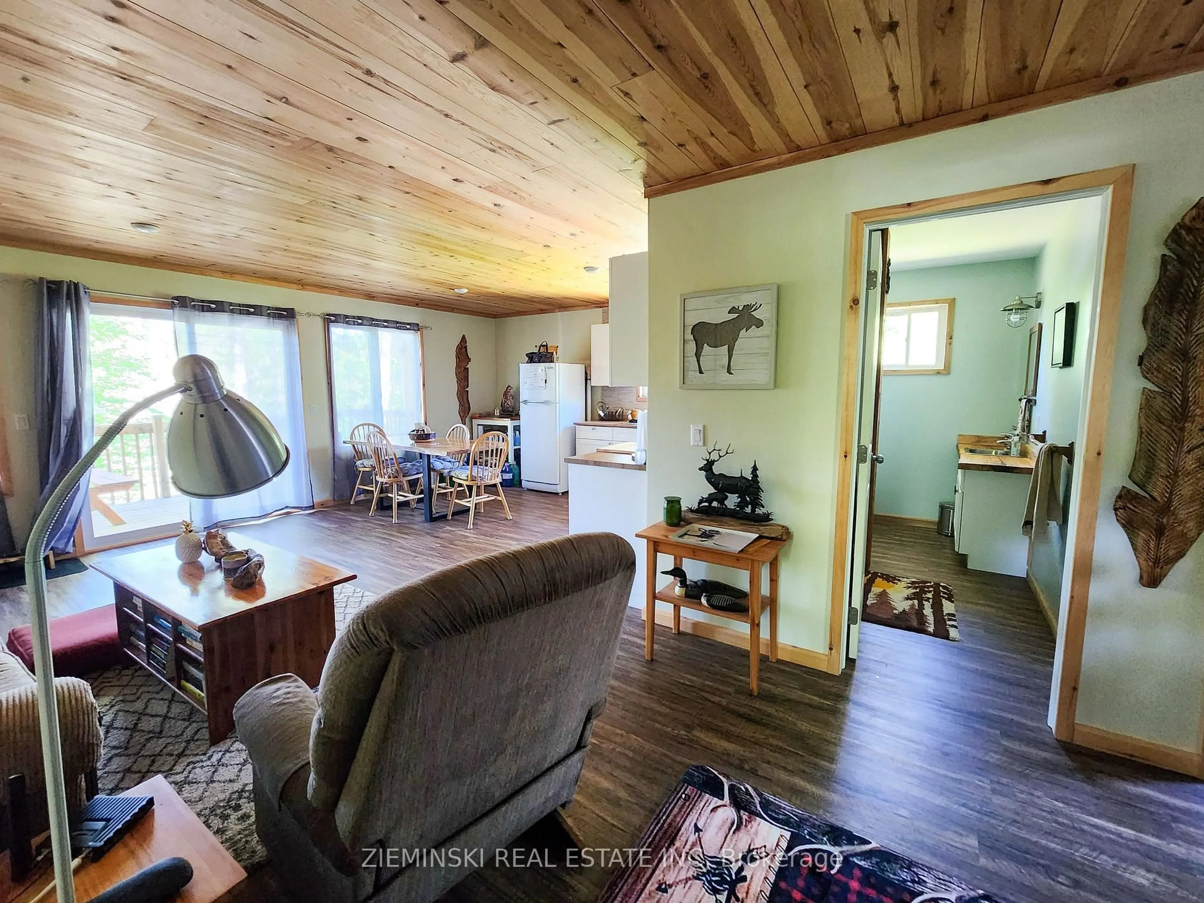 Living room with furniture, wood/laminate floor for 0 River Rd, Englehart Ontario P0J 1B0