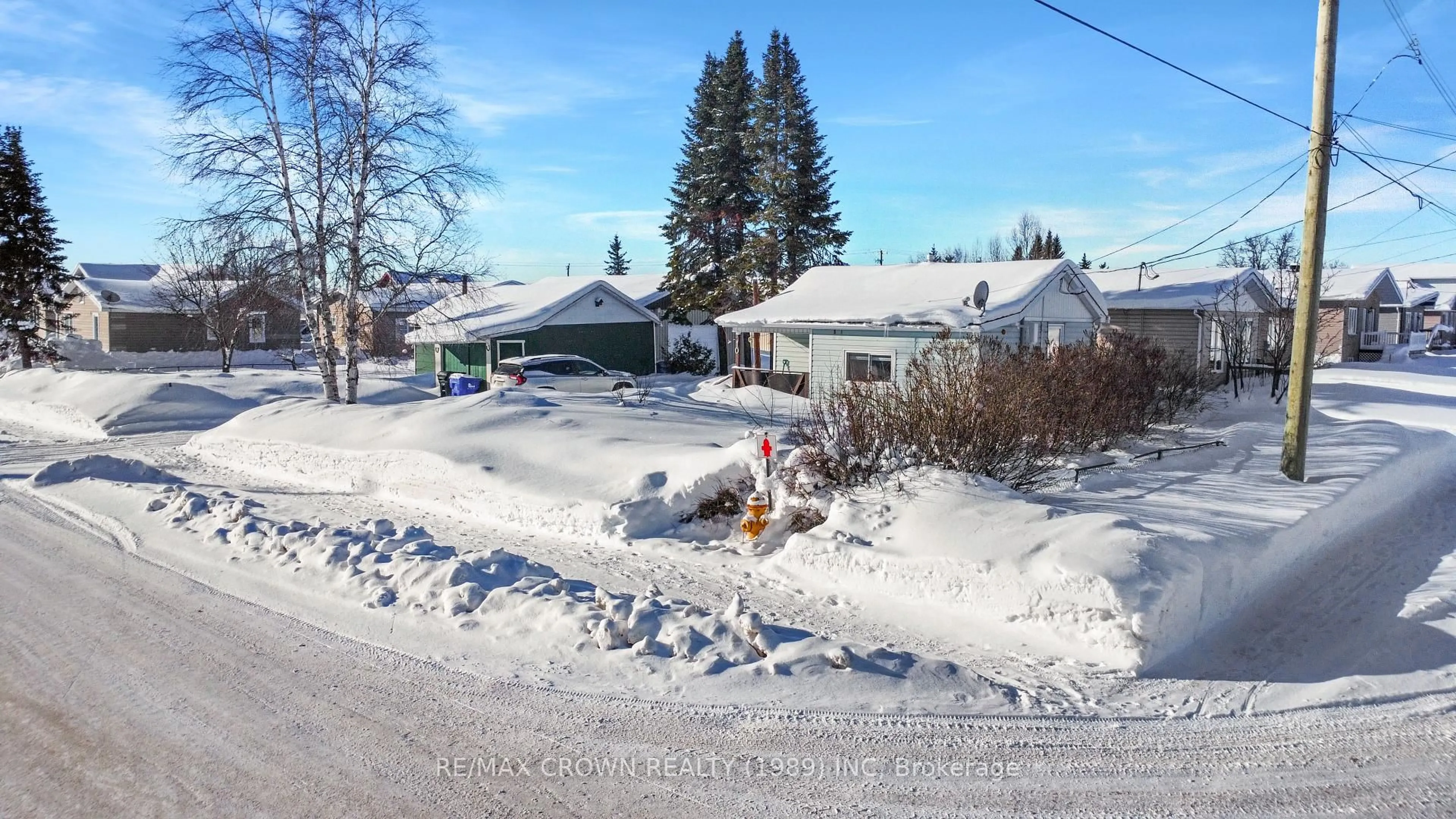 A pic from outside/outdoor area/front of a property/back of a property/a pic from drone, street for 10 Rousse St, Hearst Ontario P0L 1N0