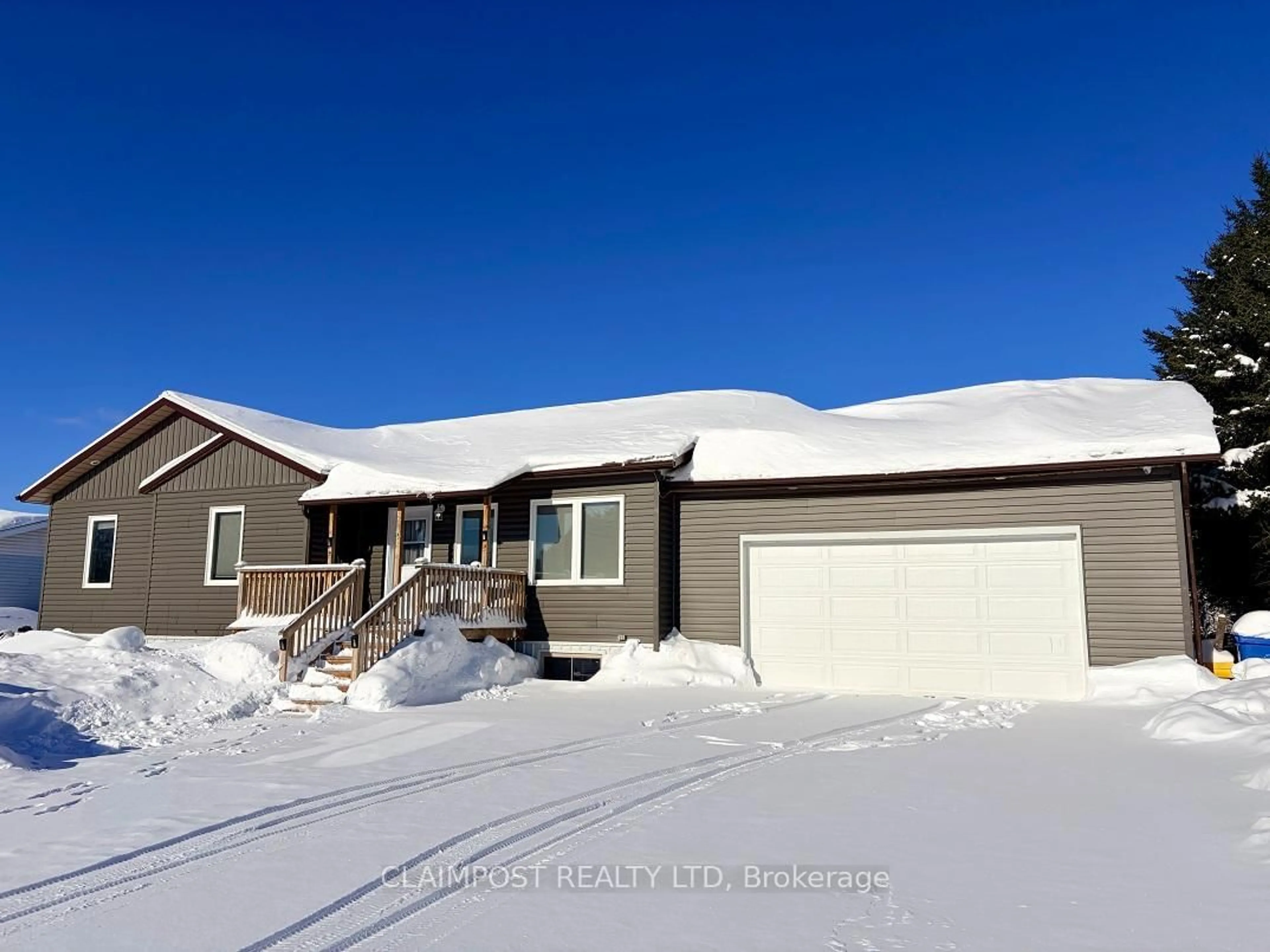 Home with vinyl exterior material, street for 24 Bowman Ave, Black River-Matheson Ontario P0K 1N0