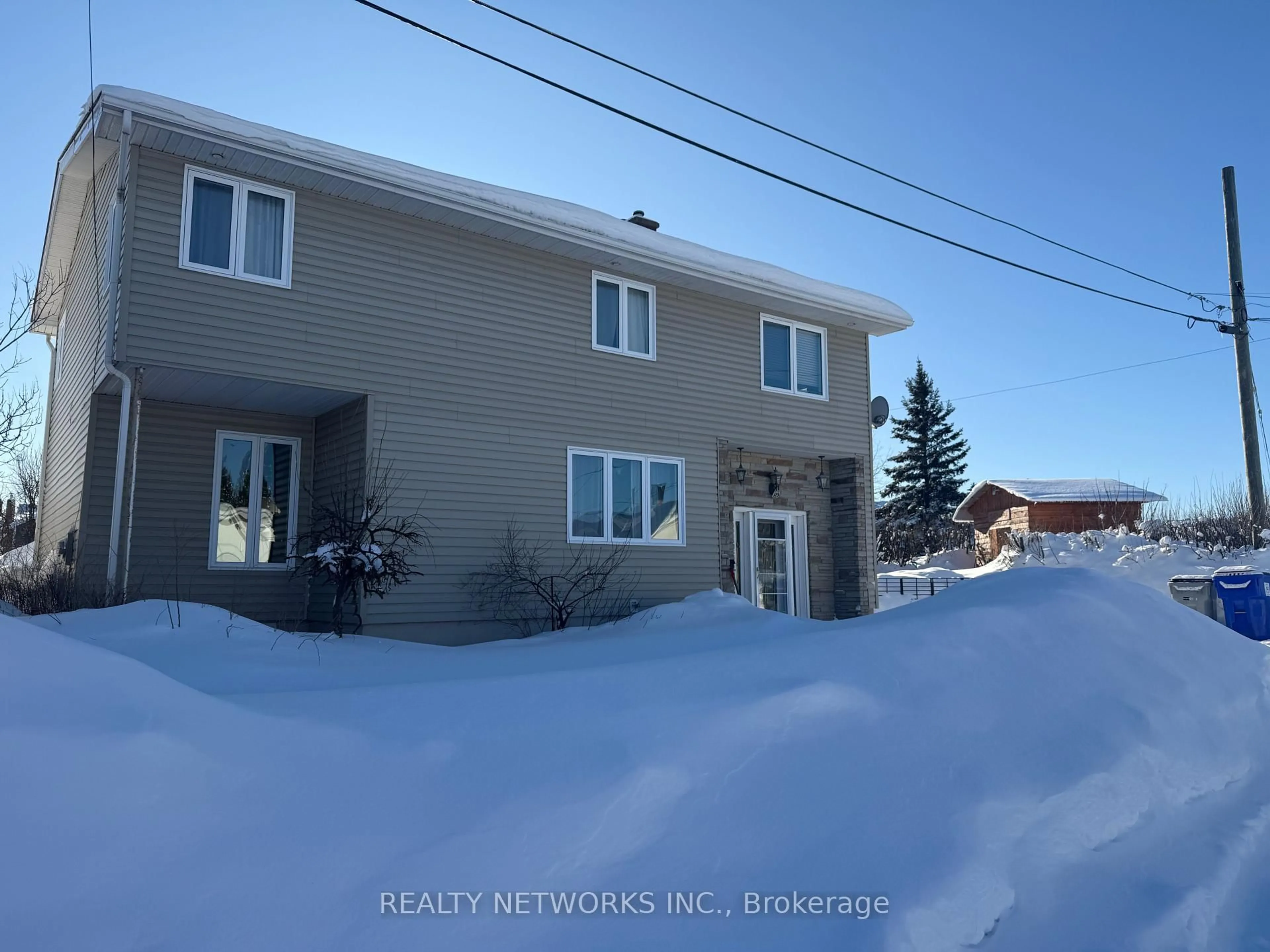 A pic from outside/outdoor area/front of a property/back of a property/a pic from drone, unknown for 315 Ann Ave, Timmins Ontario P4N 4V1