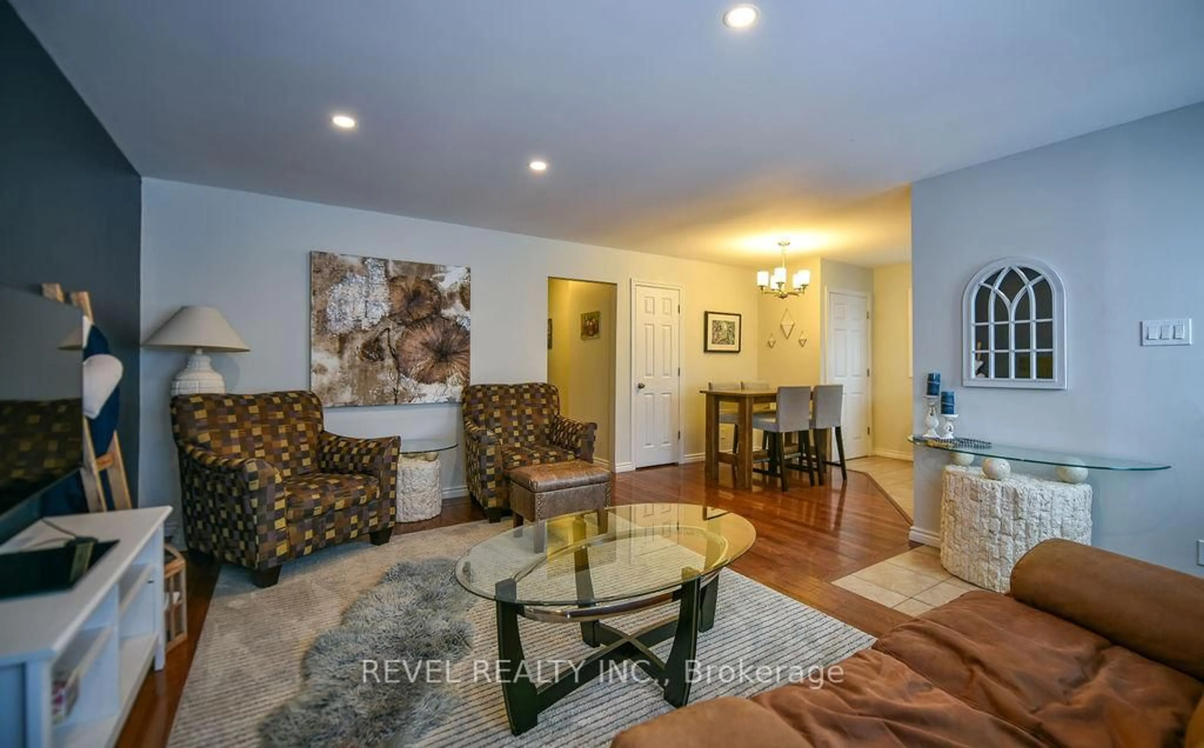 Living room with furniture, wood/laminate floor for 120 Delia Ave, Timmins Ontario P4P 1A1