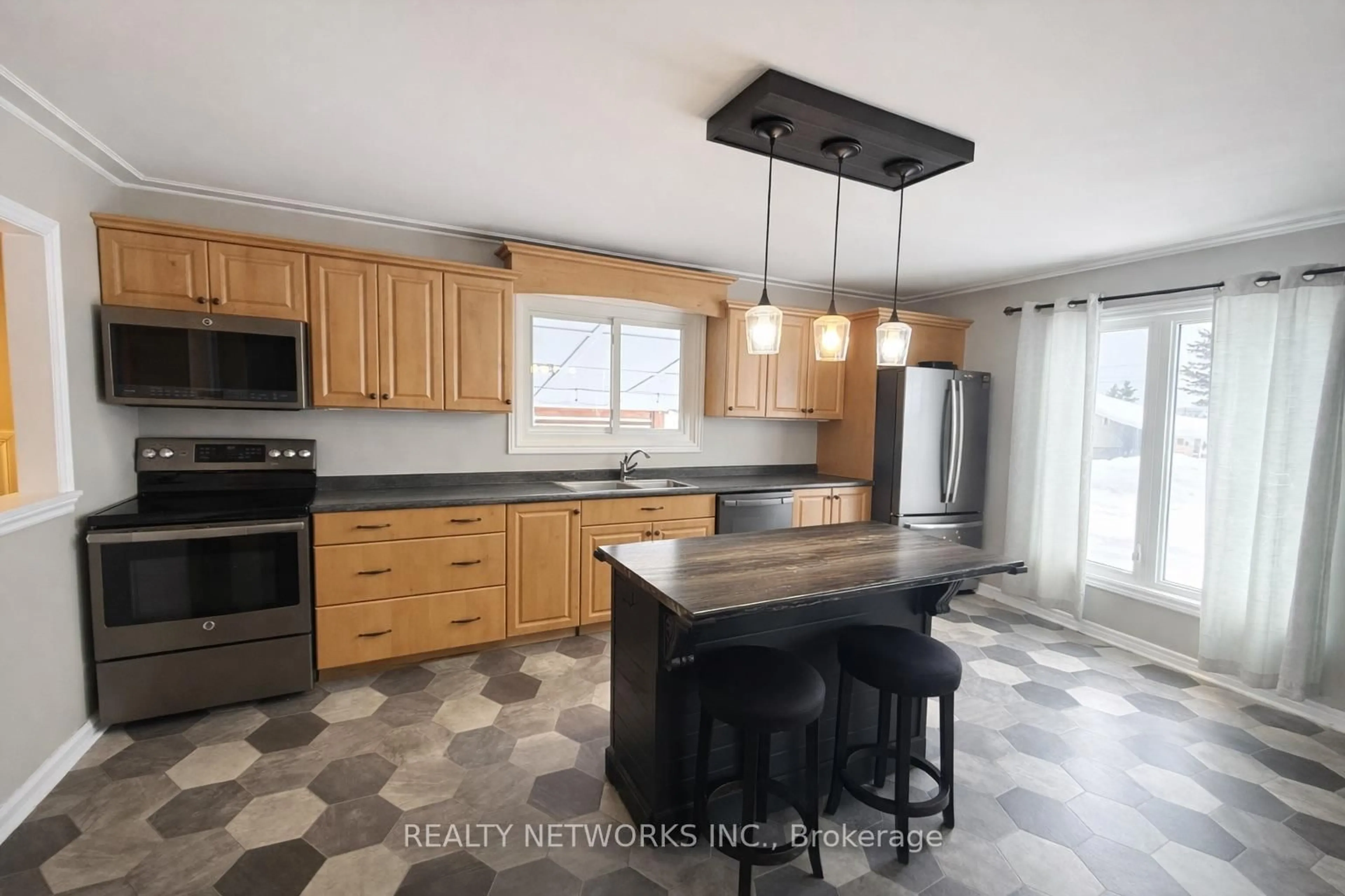 Open concept kitchen, ceramic/tile floor for 622 University St, Timmins Ontario P4N 5J3