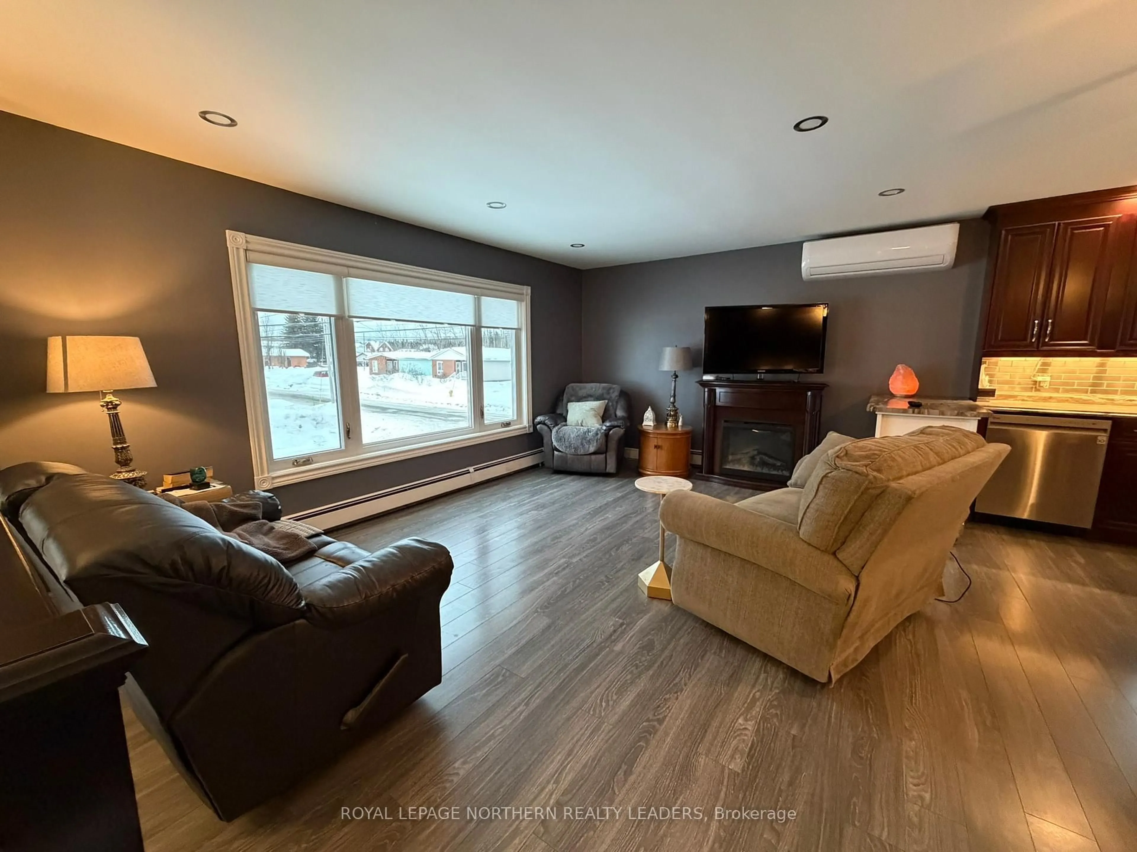 Living room with furniture, wood/laminate floor for 101 Ruth St, Timmins Ontario P0N 1C0