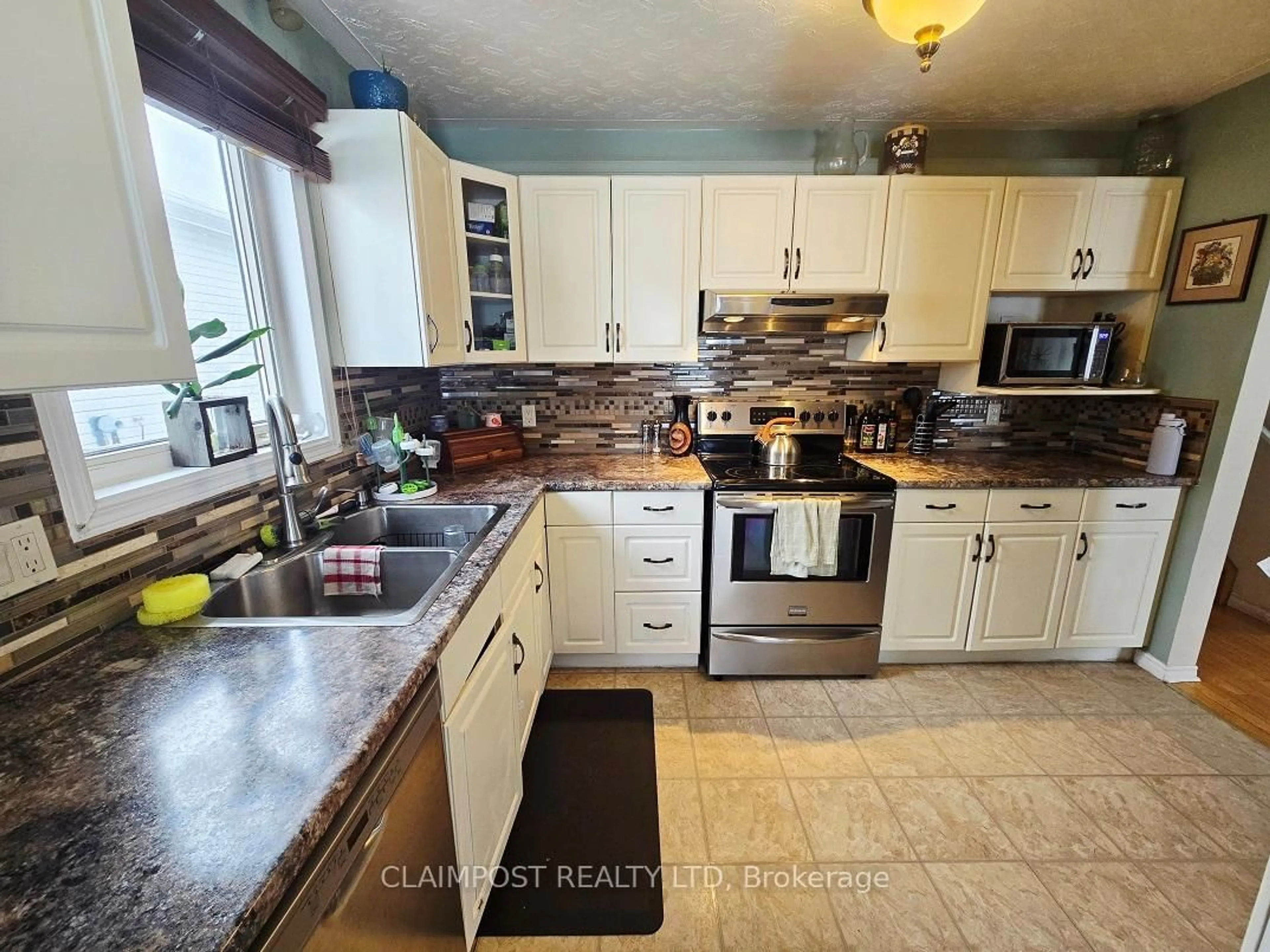 Open concept kitchen, ceramic/tile floor for 1266 Park Ave, Timmins Ontario P4R 1L8