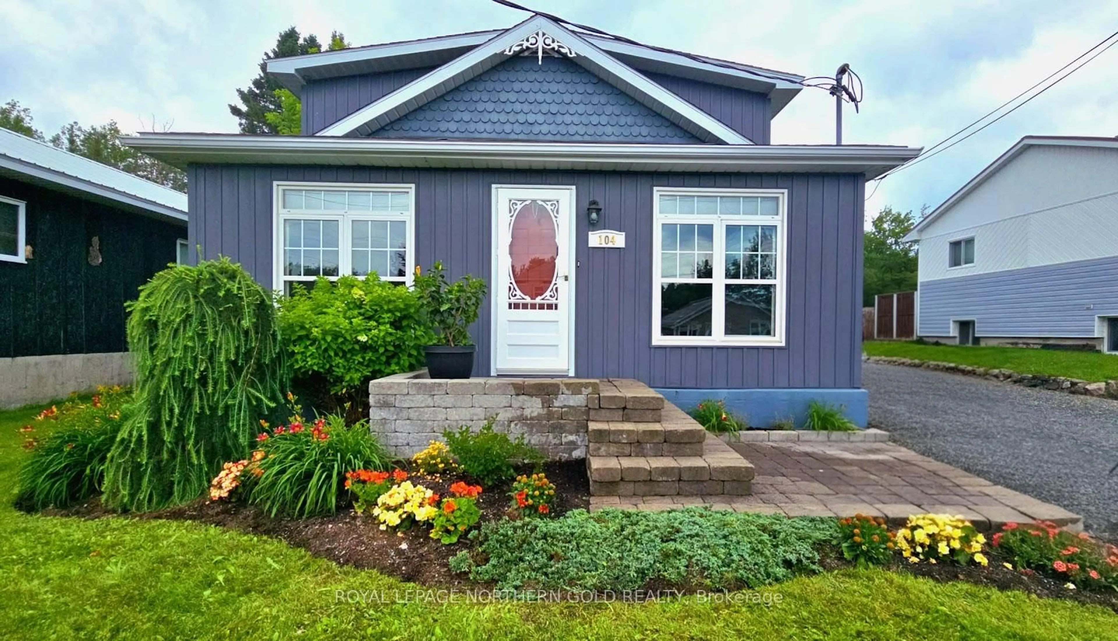 Home with vinyl exterior material, street for 104 Wishman St, Kirkland Lake Ontario P2N 1H1