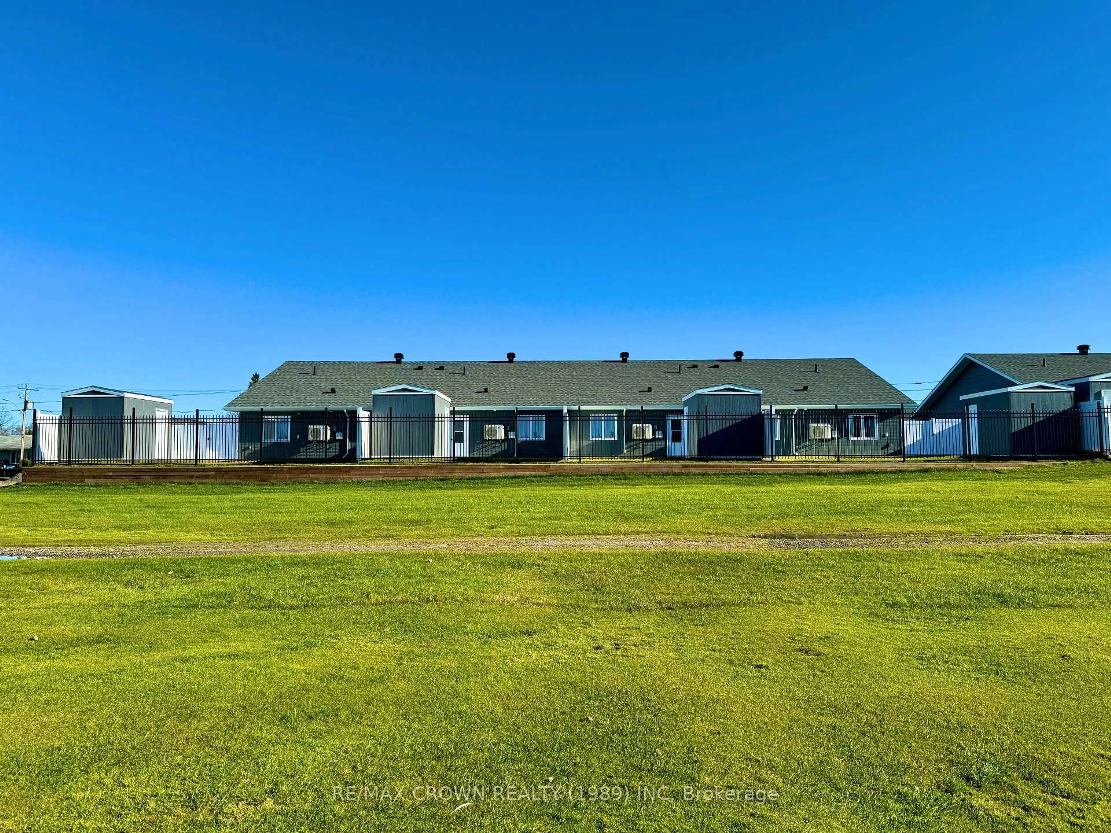 A pic from outside/outdoor area/front of a property/back of a property/a pic from drone, water/lake/river/ocean view for 24 Golf St, Kapuskasing Ontario P5N 3J6