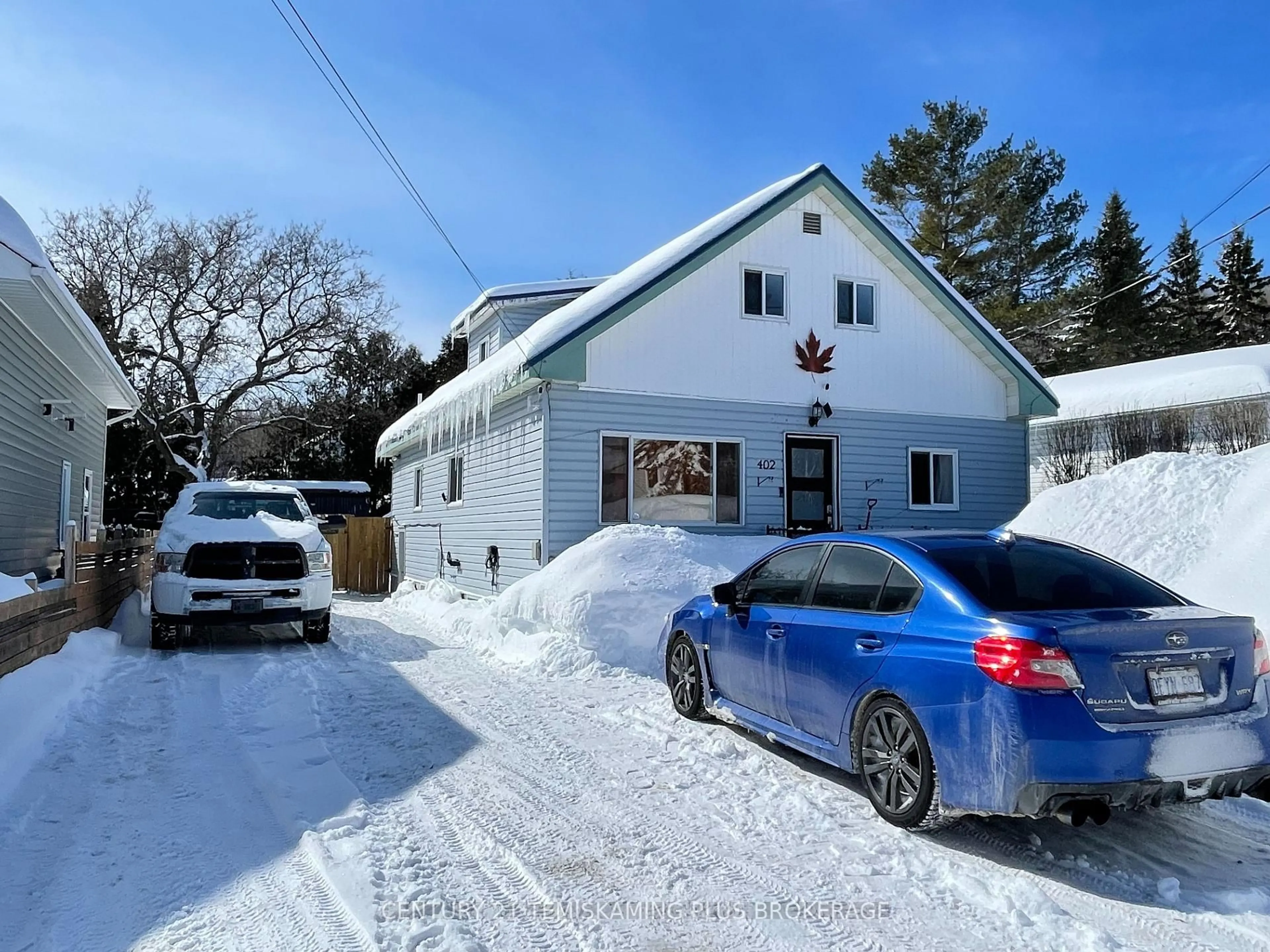 A pic from outside/outdoor area/front of a property/back of a property/a pic from drone, street for 402 Farah Ave, Temiskaming Shores Ontario P0J 1P0