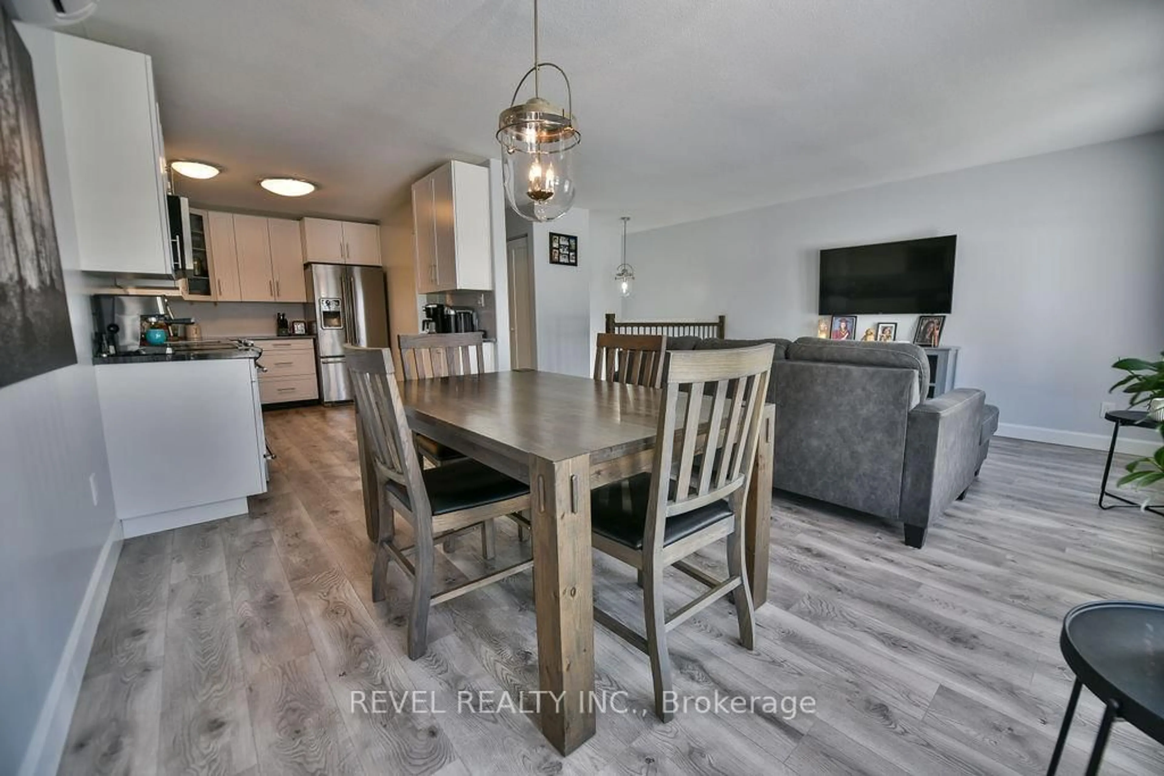 Open concept kitchen, wood/laminate floor for 1301 Lozanne Cres, Timmins Ontario P4P 1E7