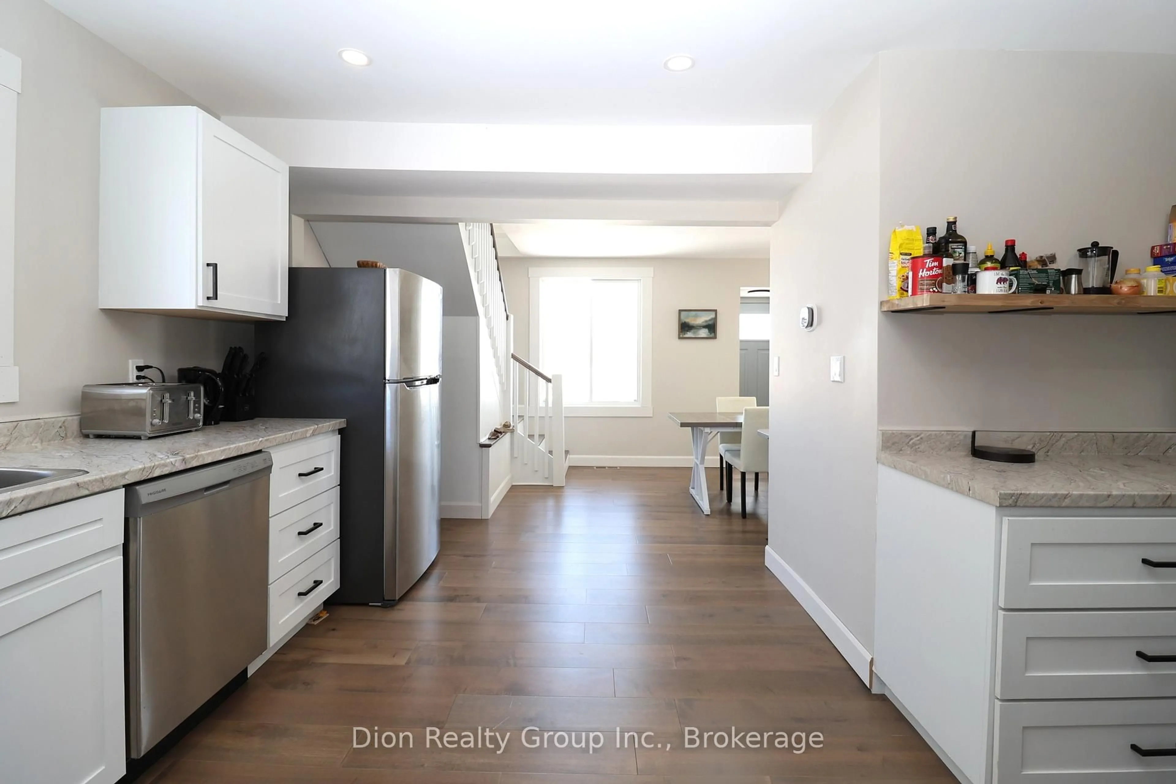 Open concept kitchen, wood/laminate floor for 76 Commissioner St, Kirkland Lake Ontario P0K 1L0