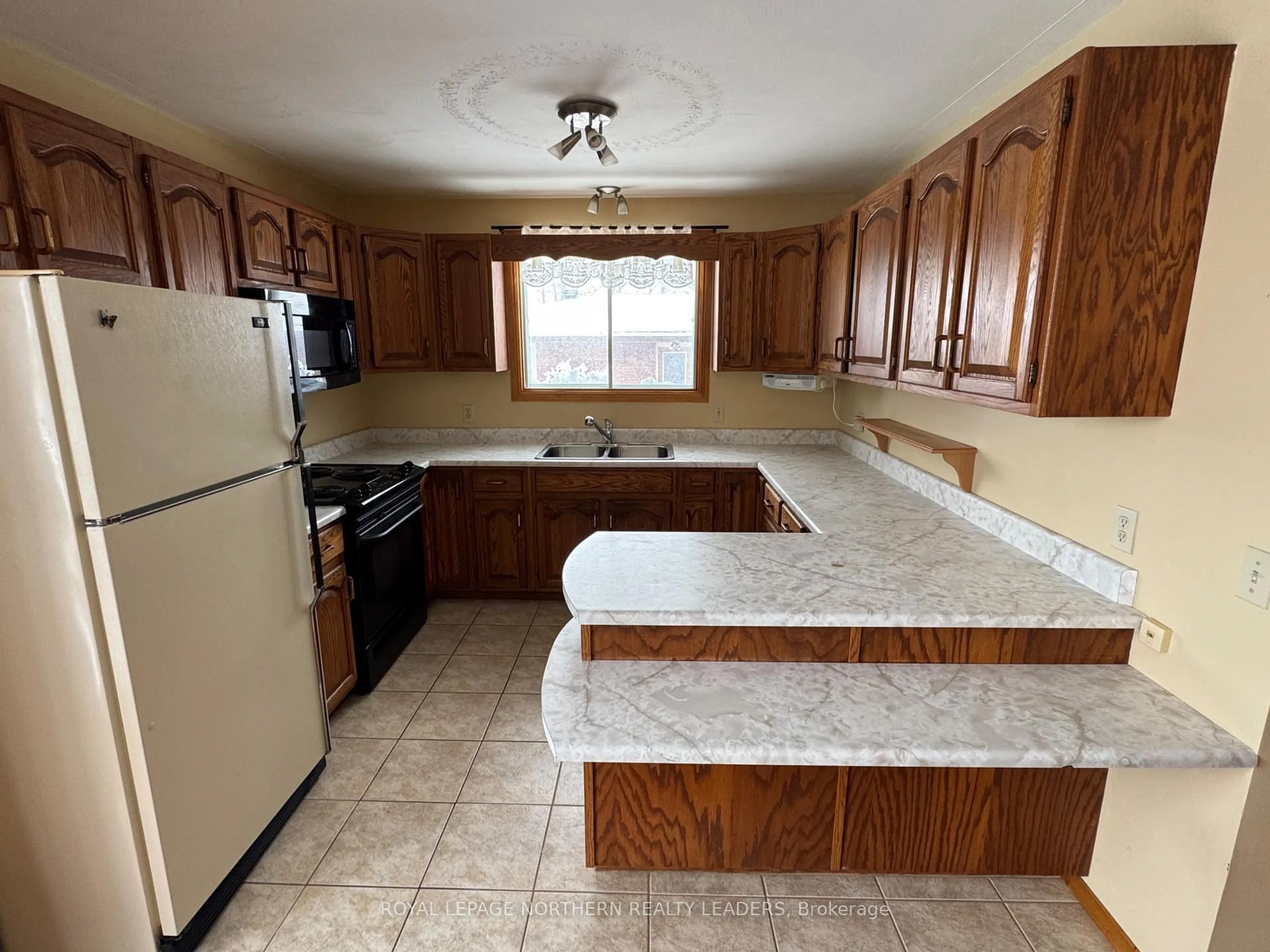 Standard kitchen, ceramic/tile floor for 70 Clifford Ave, Timmins Ontario P4R 1B6