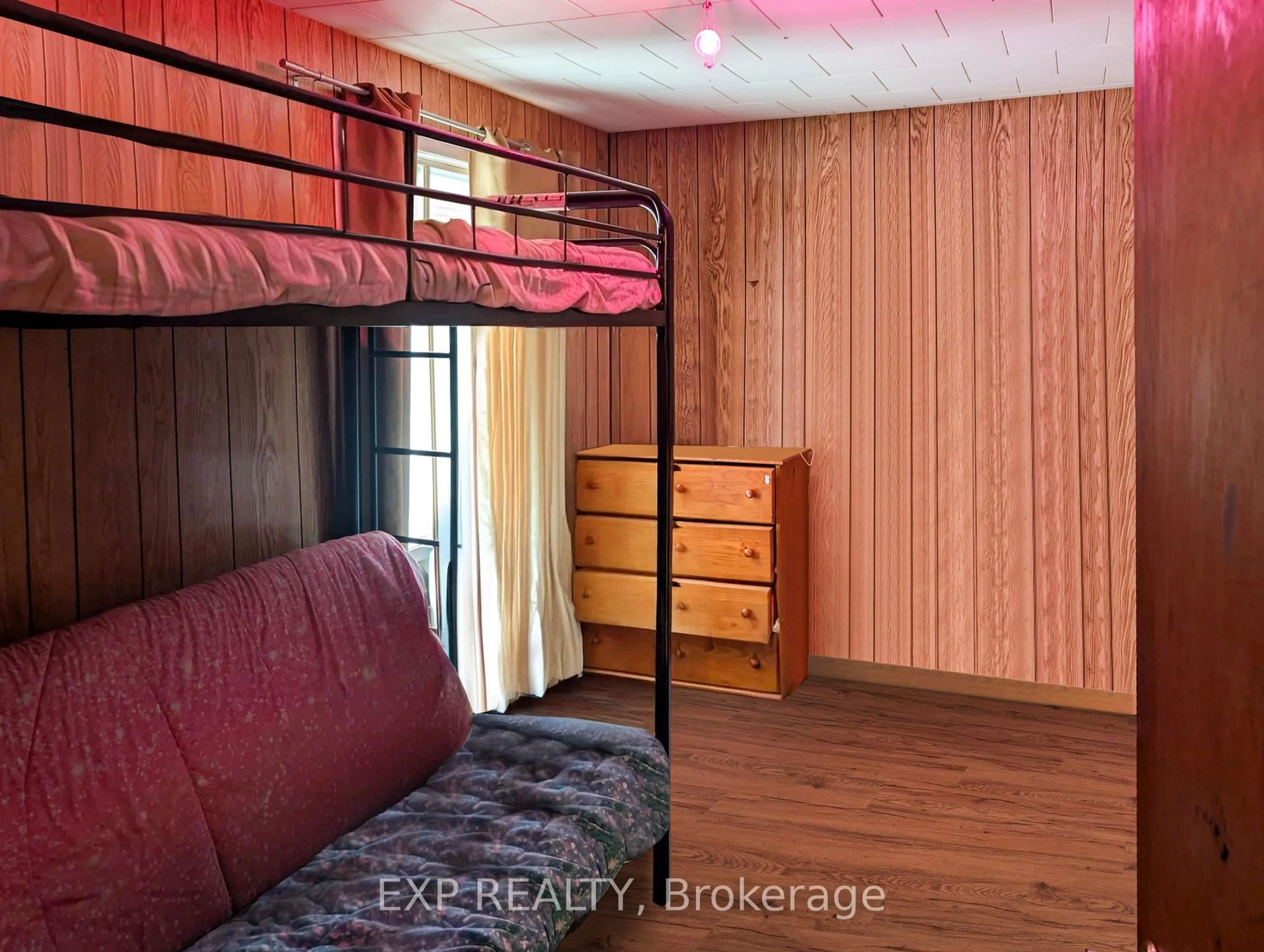 Bedroom with bed, wood/laminate floor for 111 Taylor Ave, Kirkland Lake Ontario P2N 2L8