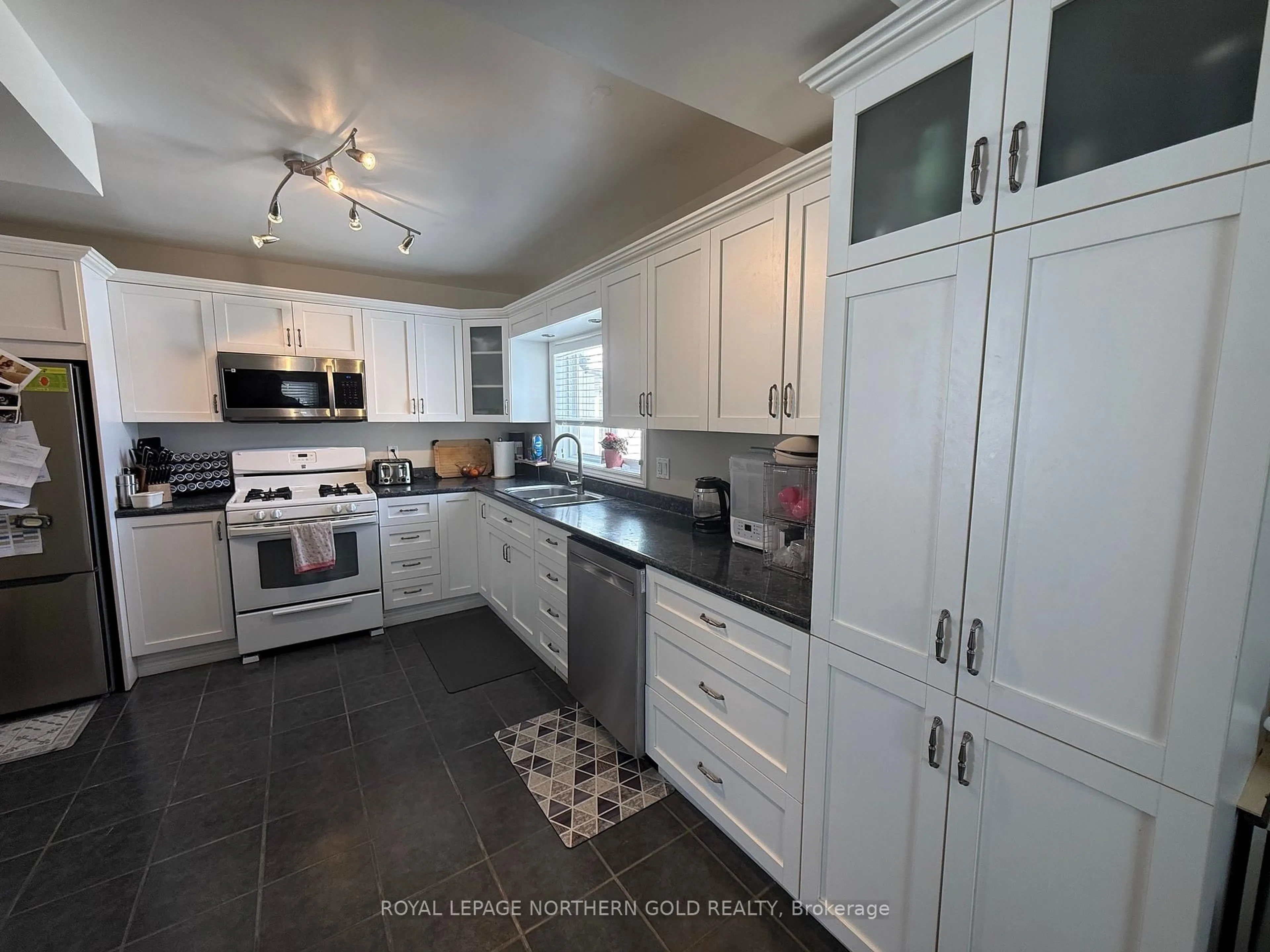 Open concept kitchen, ceramic/tile floor for 38 Comfort St, Kirkland Lake Ontario P2N 3B2