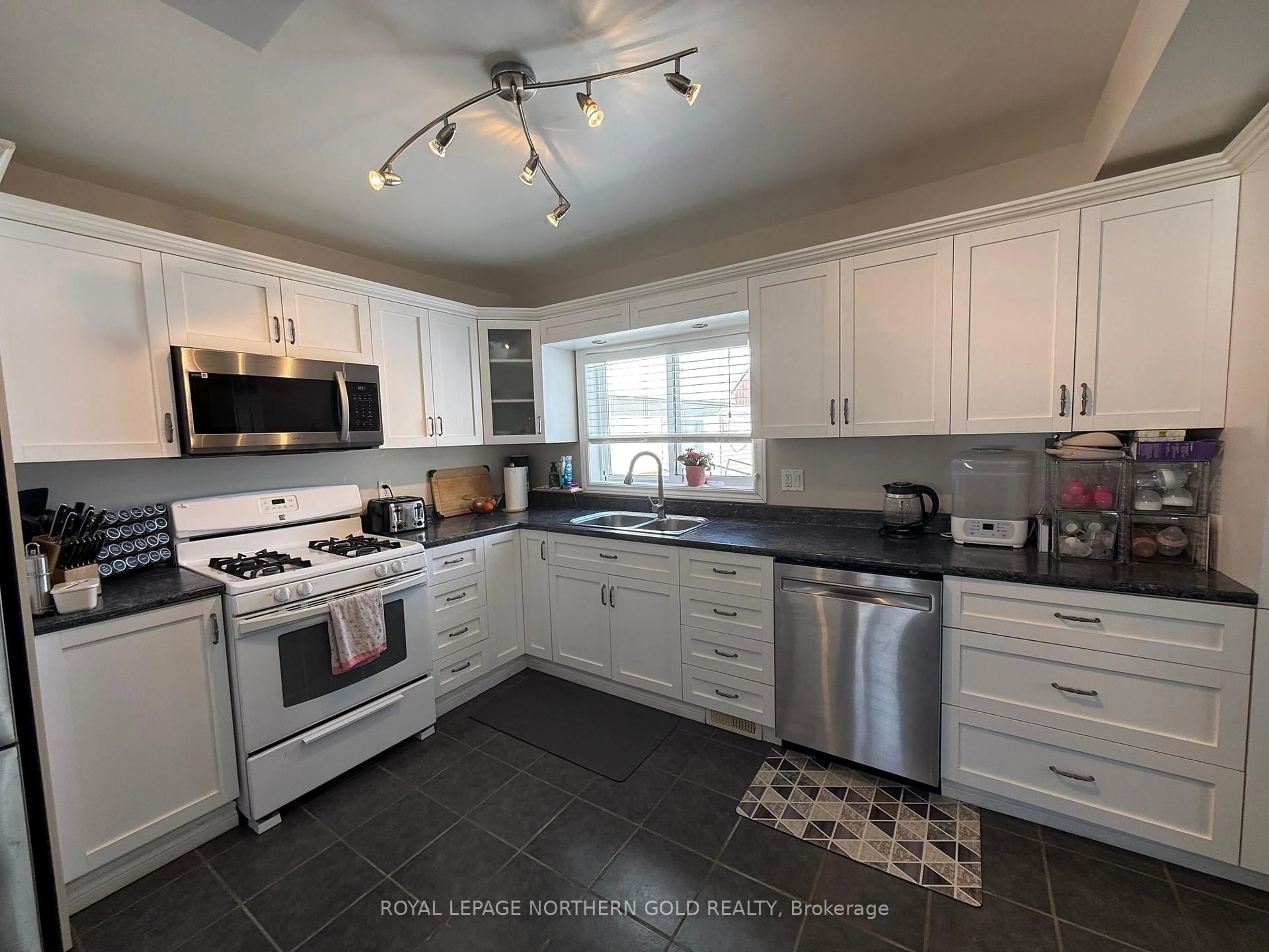 Open concept kitchen, ceramic/tile floor for 38 Comfort St, Kirkland Lake Ontario P2N 3B2