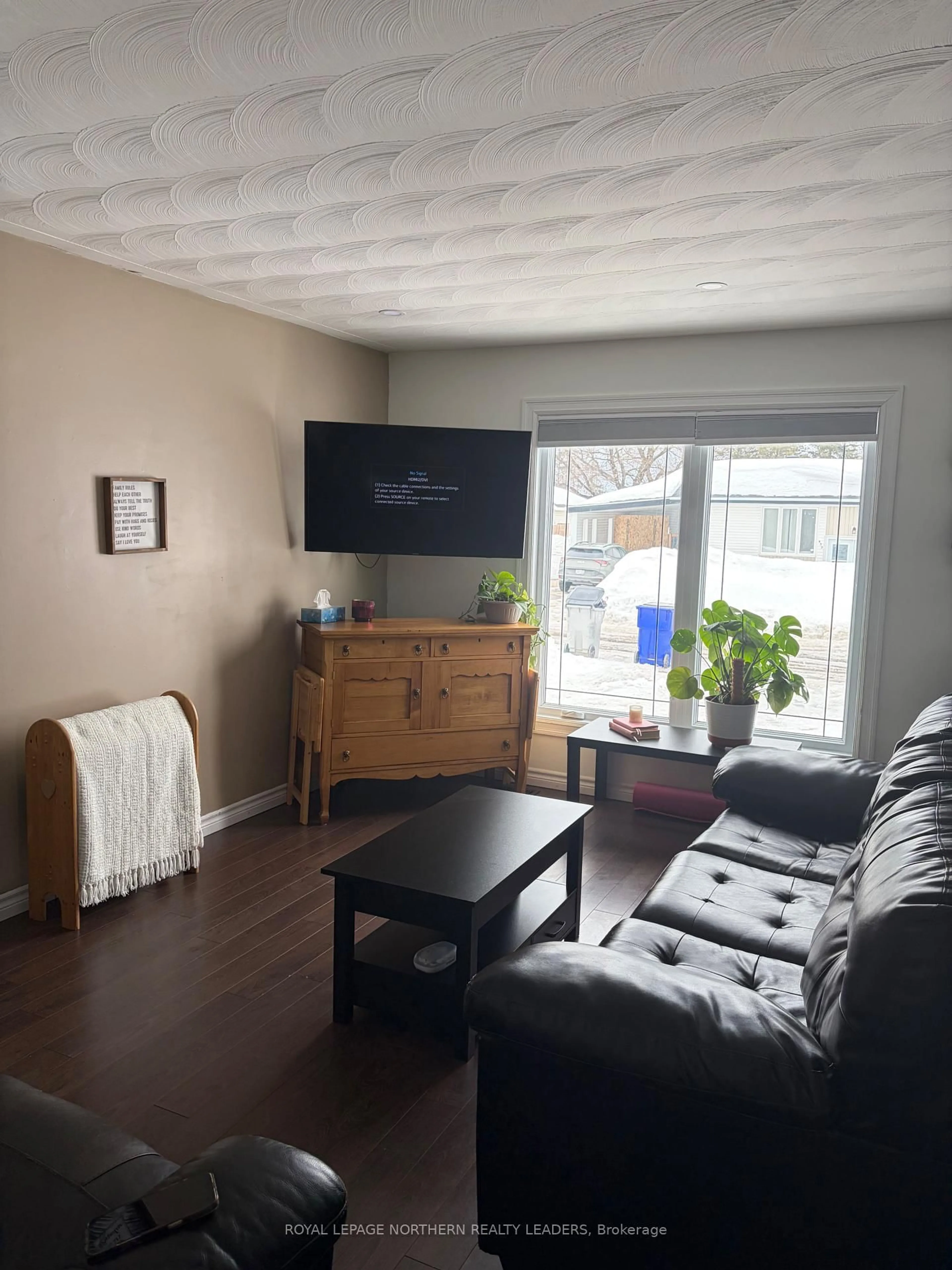 Living room with furniture, wood/laminate floor for 429 Ann Ave, Timmins Ontario P4N 4V3