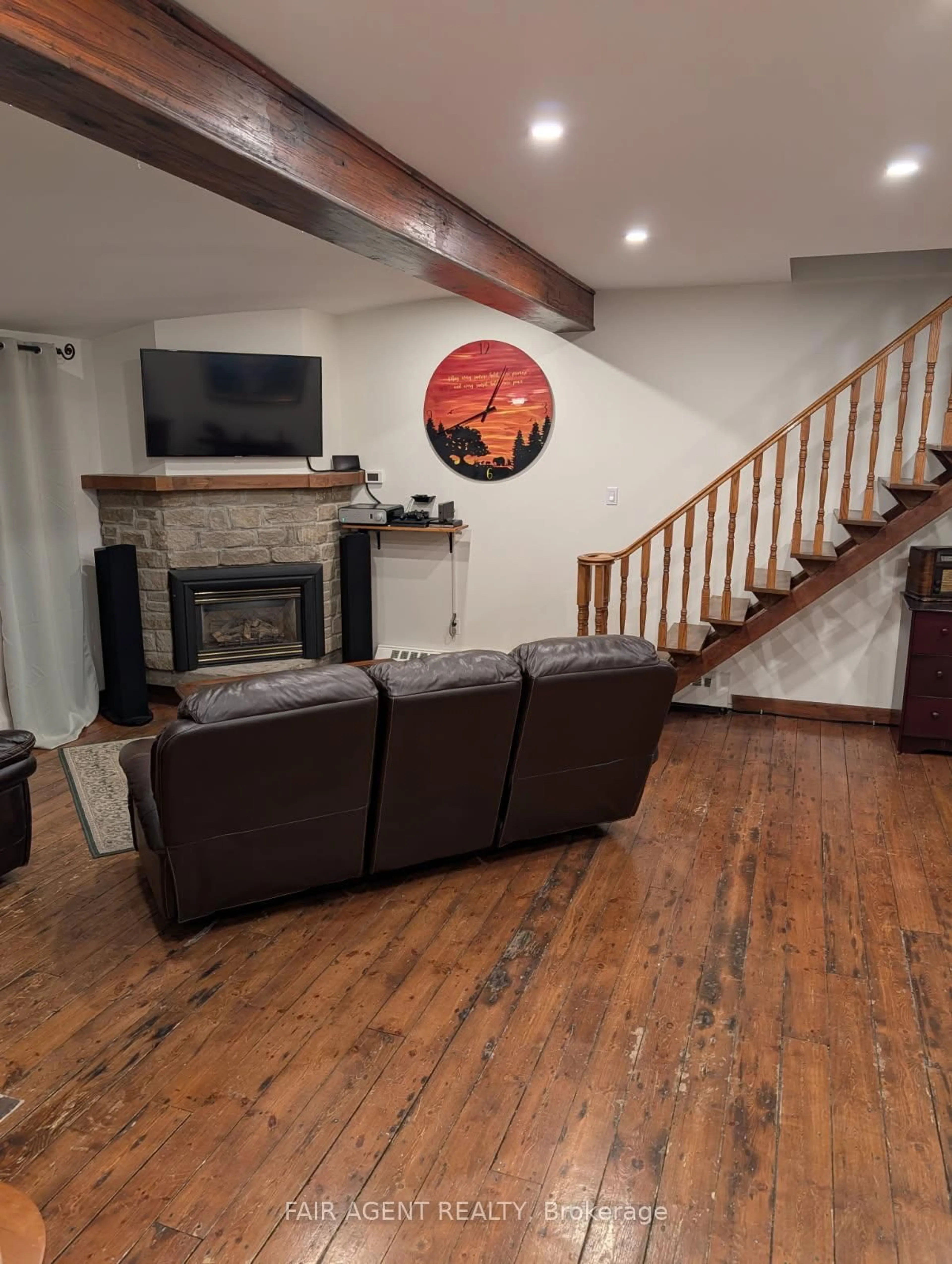 Living room with furniture, wood/laminate floor for 743022 & 743024 Dawson Point Rd, Timiskaming Ontario P0J 1P0