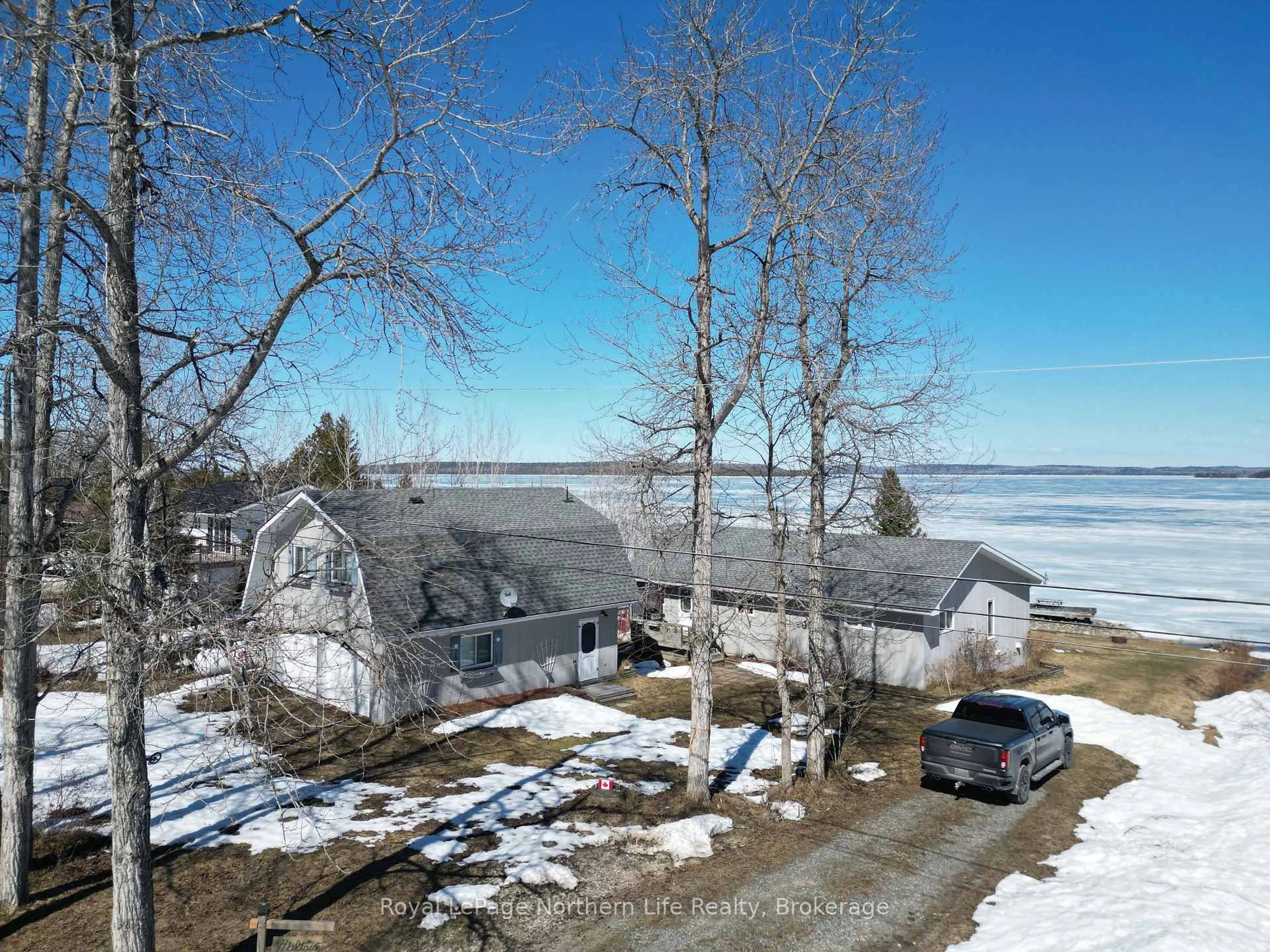 A pic from outside/outdoor area/front of a property/back of a property/a pic from drone, water/lake/river/ocean view for 501182 Berry Rd, Timiskaming Ontario P0J 1R0