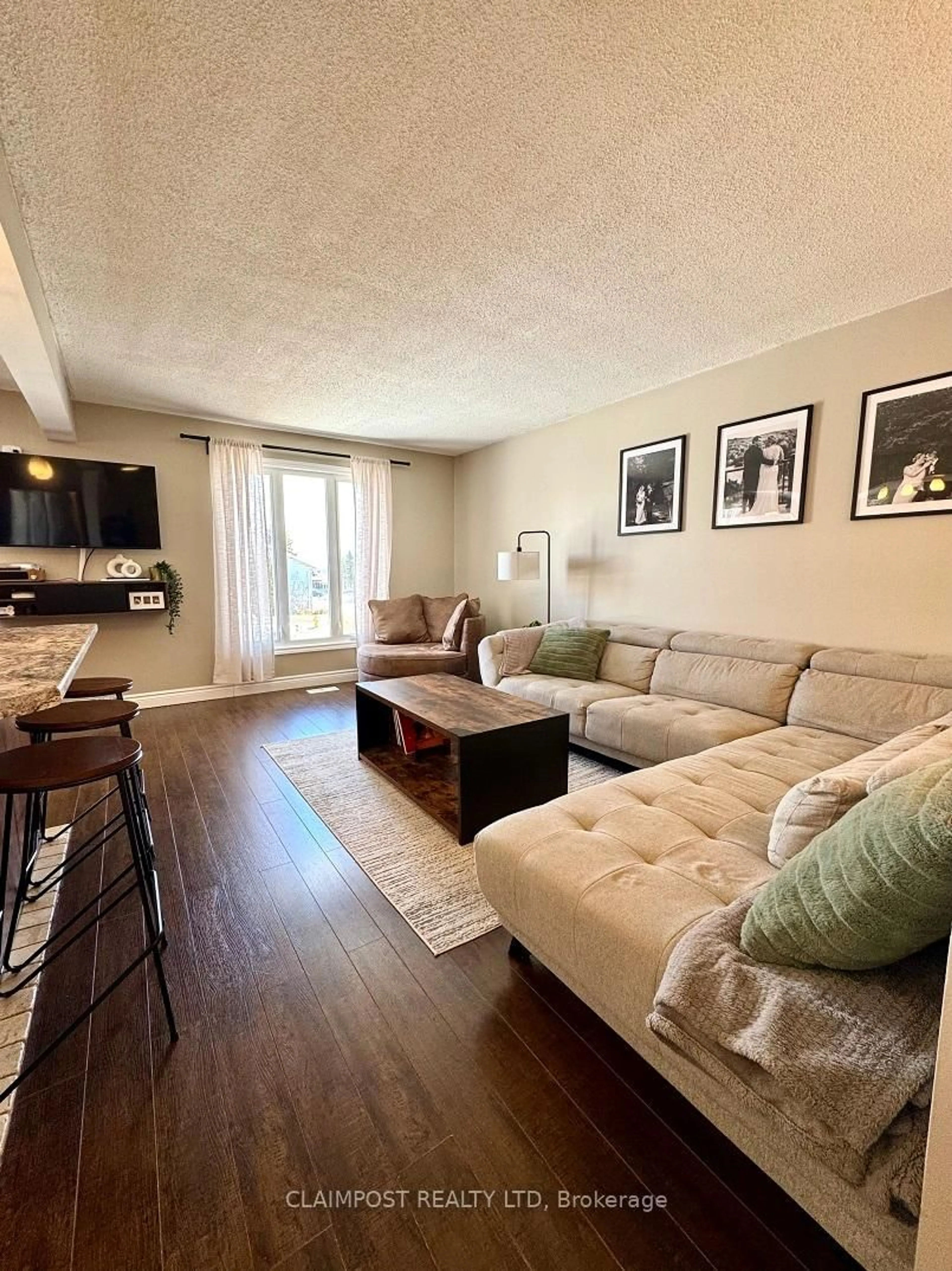 Living room with furniture, wood/laminate floor for 166 Renison Ave, Timmins Ontario P0N 1K0