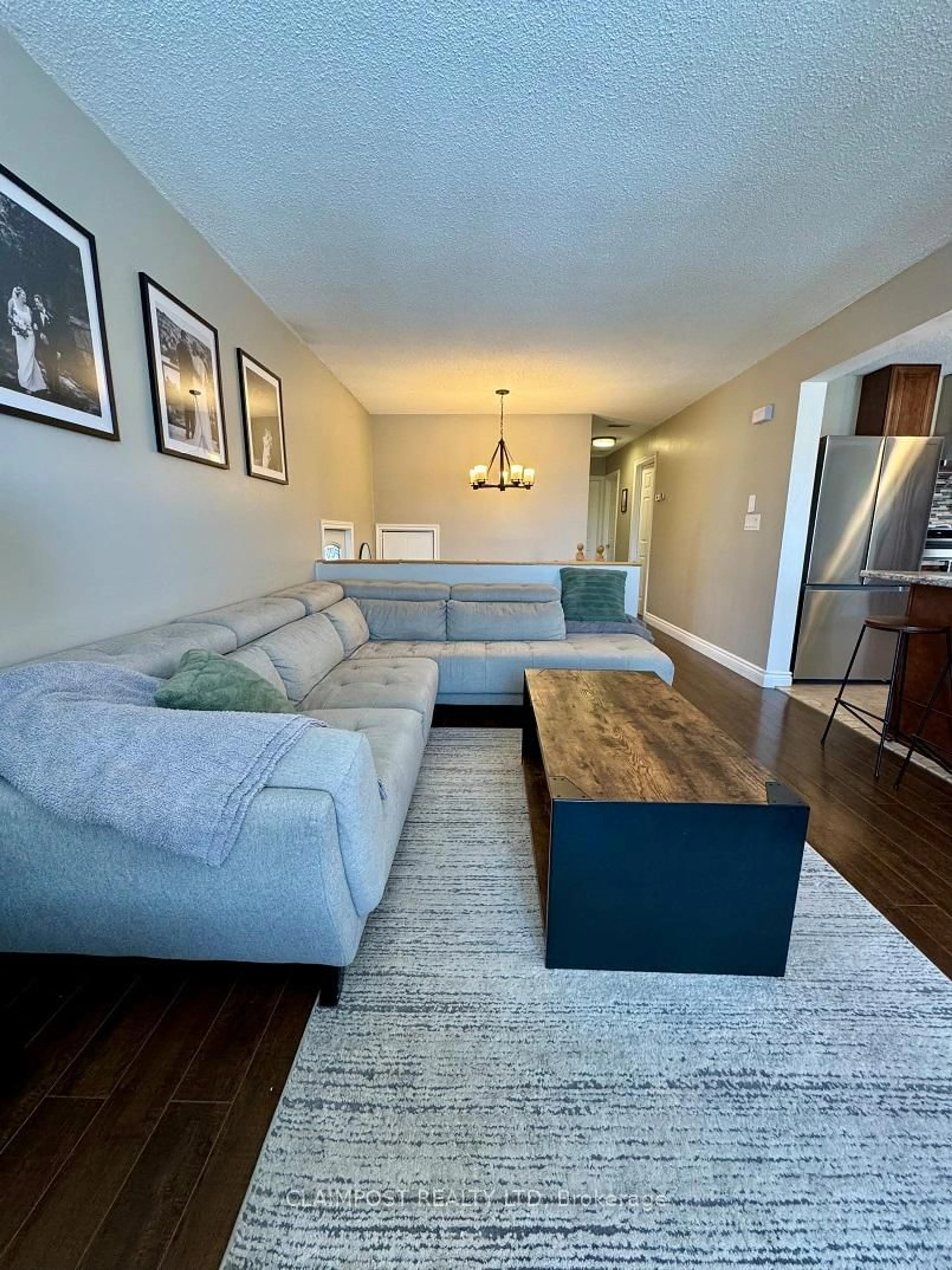 Living room with furniture, wood/laminate floor for 166 Renison Ave, Timmins Ontario P0N 1K0