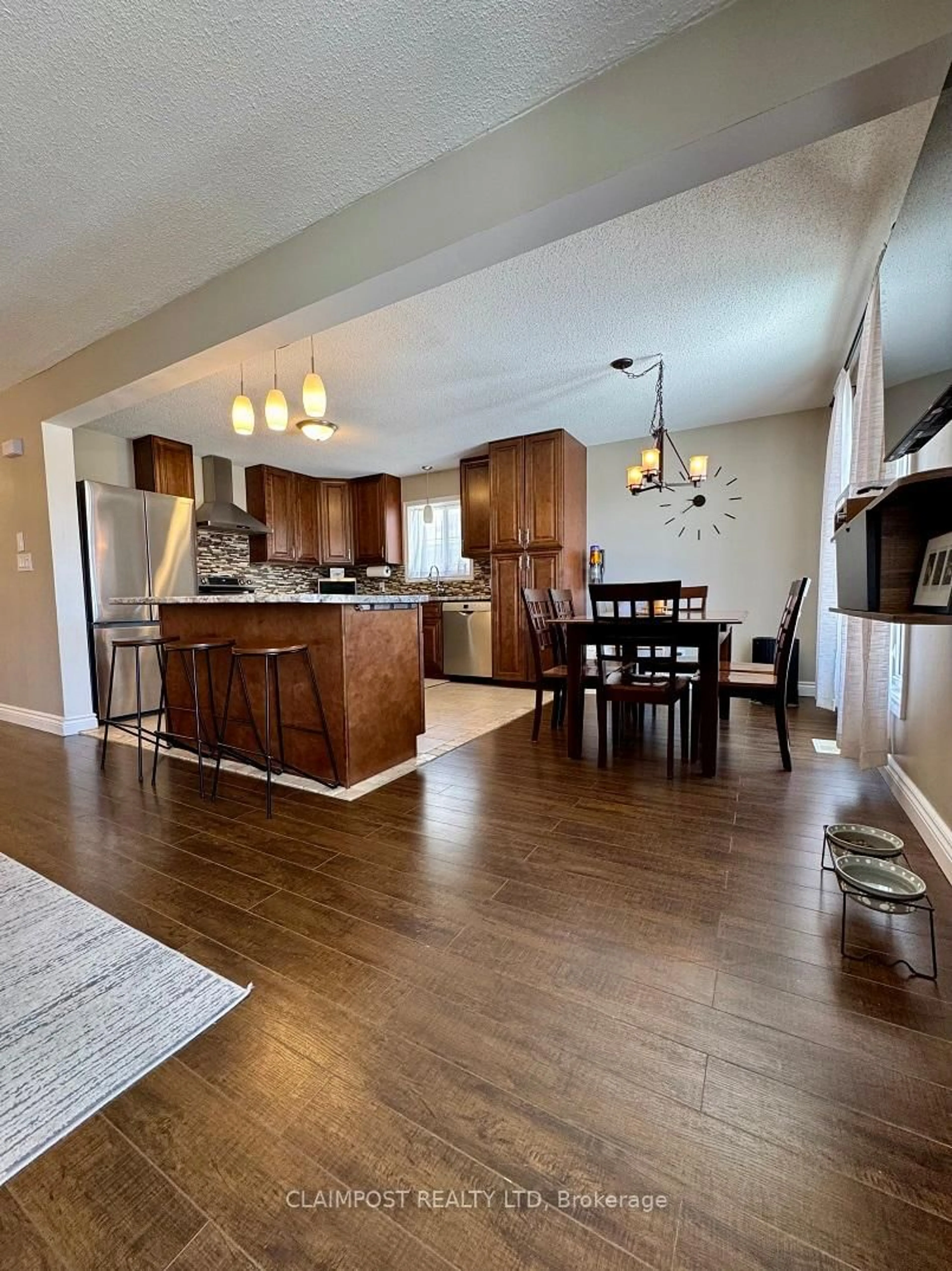 Open concept kitchen, wood/laminate floor for 166 Renison Ave, Timmins Ontario P0N 1K0