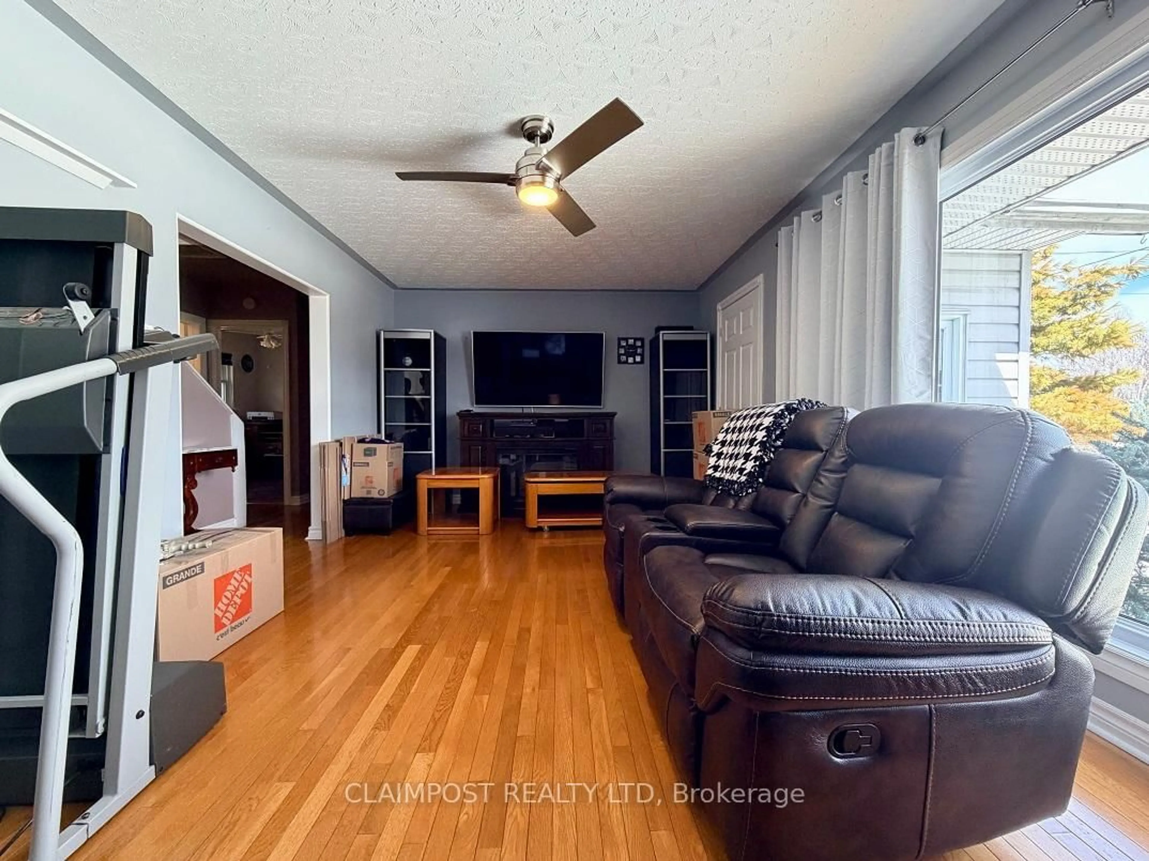 Living room with furniture, wood/laminate floor for 453 Second Ave, Black River-Matheson Ontario P0K 1N0