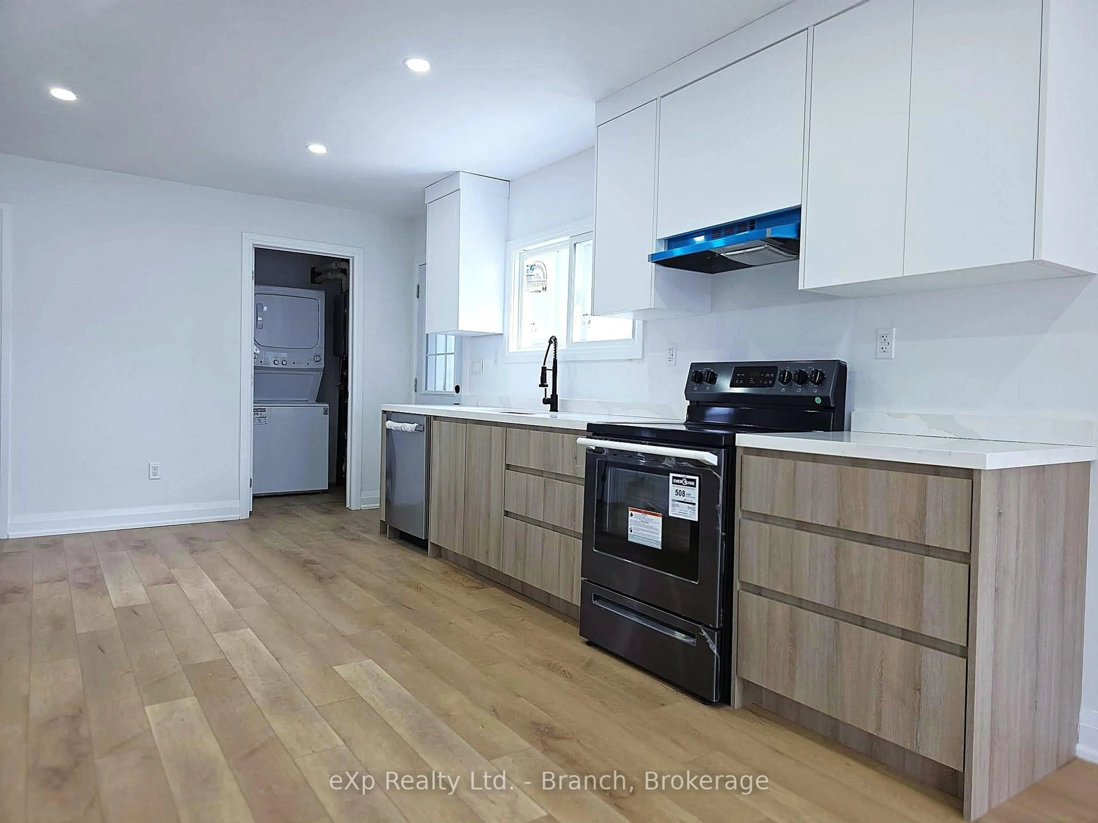 Open concept kitchen, wood/laminate floor for 6 Wilson Ave, Kirkland Lake Ontario P2N 1J7