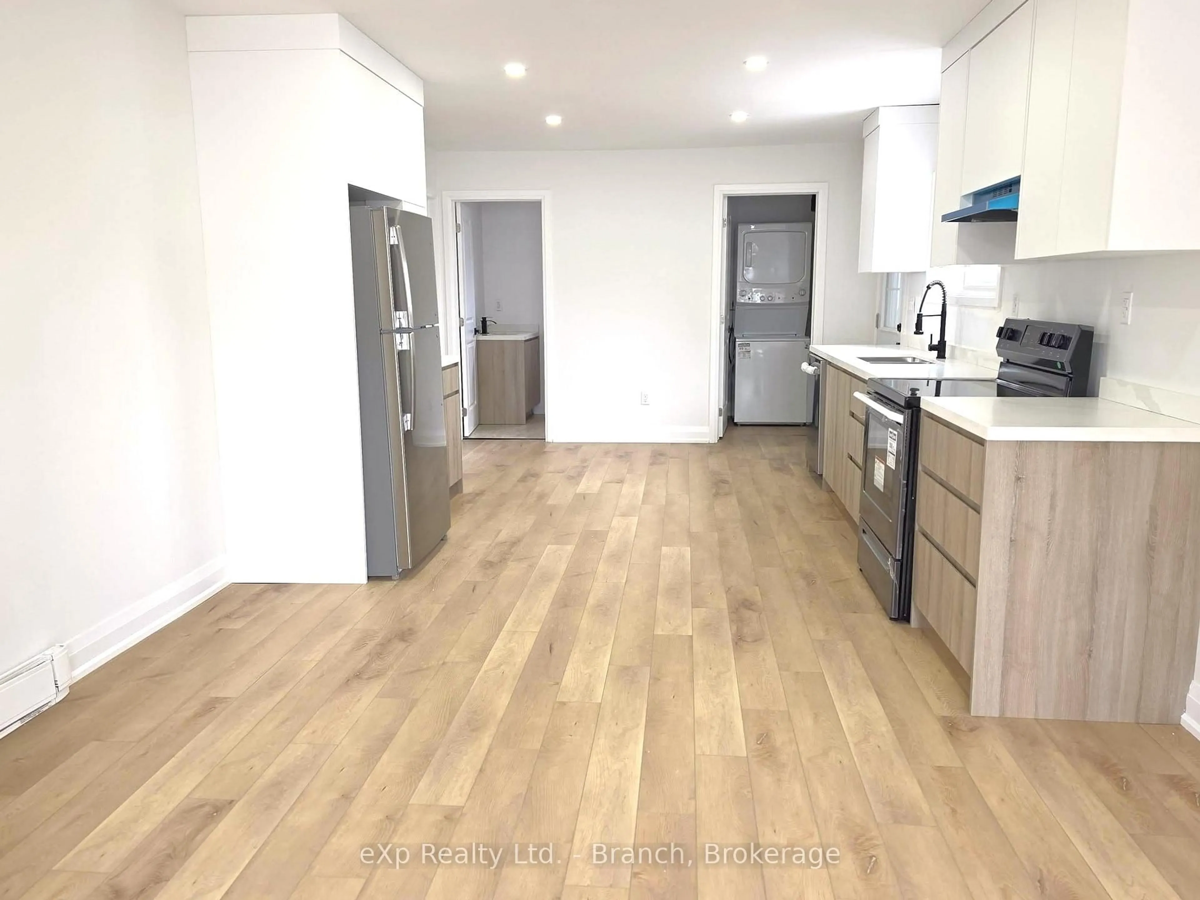 Open concept kitchen, wood/laminate floor for 6 Wilson Ave, Kirkland Lake Ontario P2N 1J7