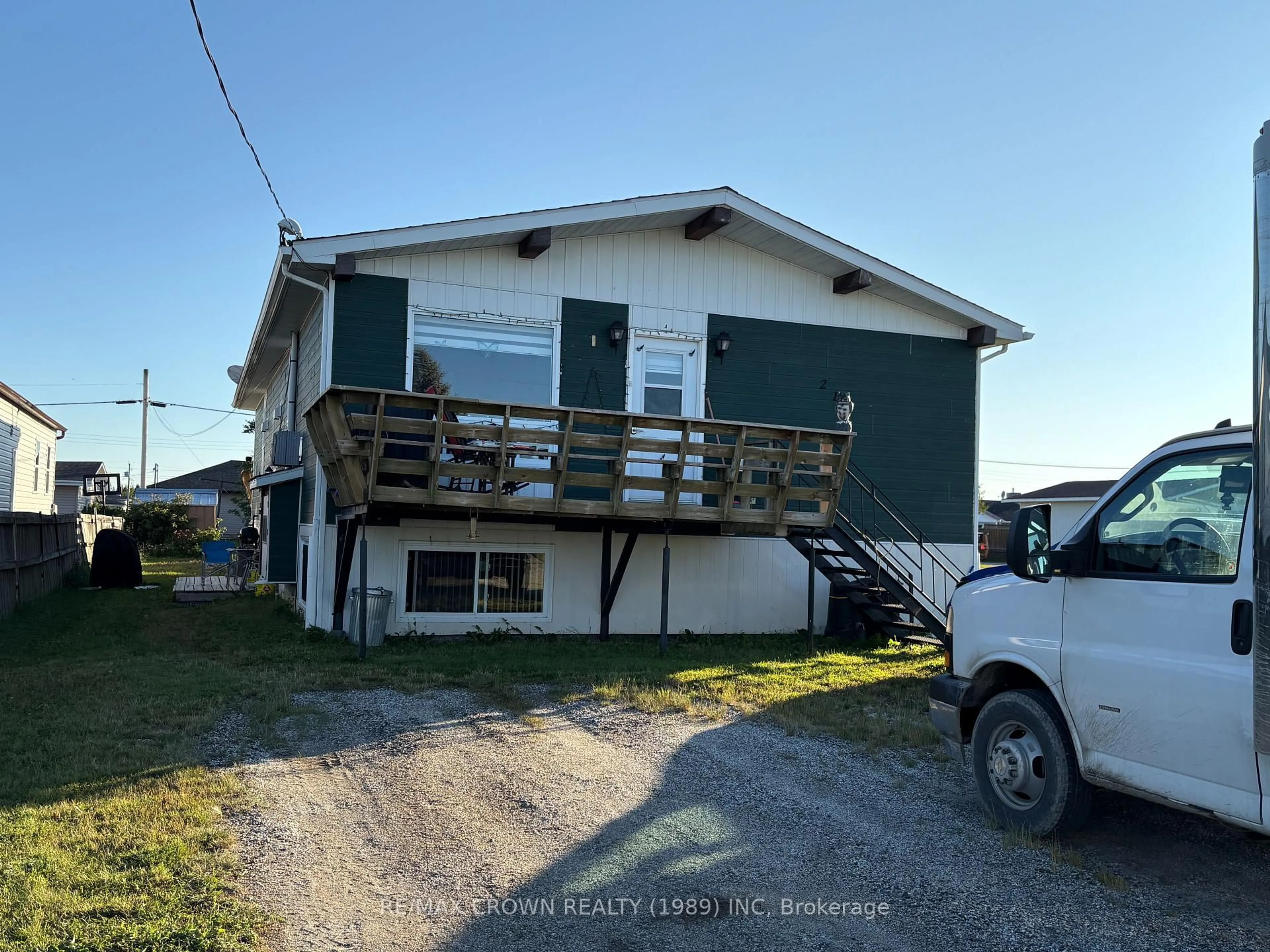 Home with vinyl exterior material, street for 213 Balmoral Ave, Mattice-Val Cote Ontario P0L 1T0