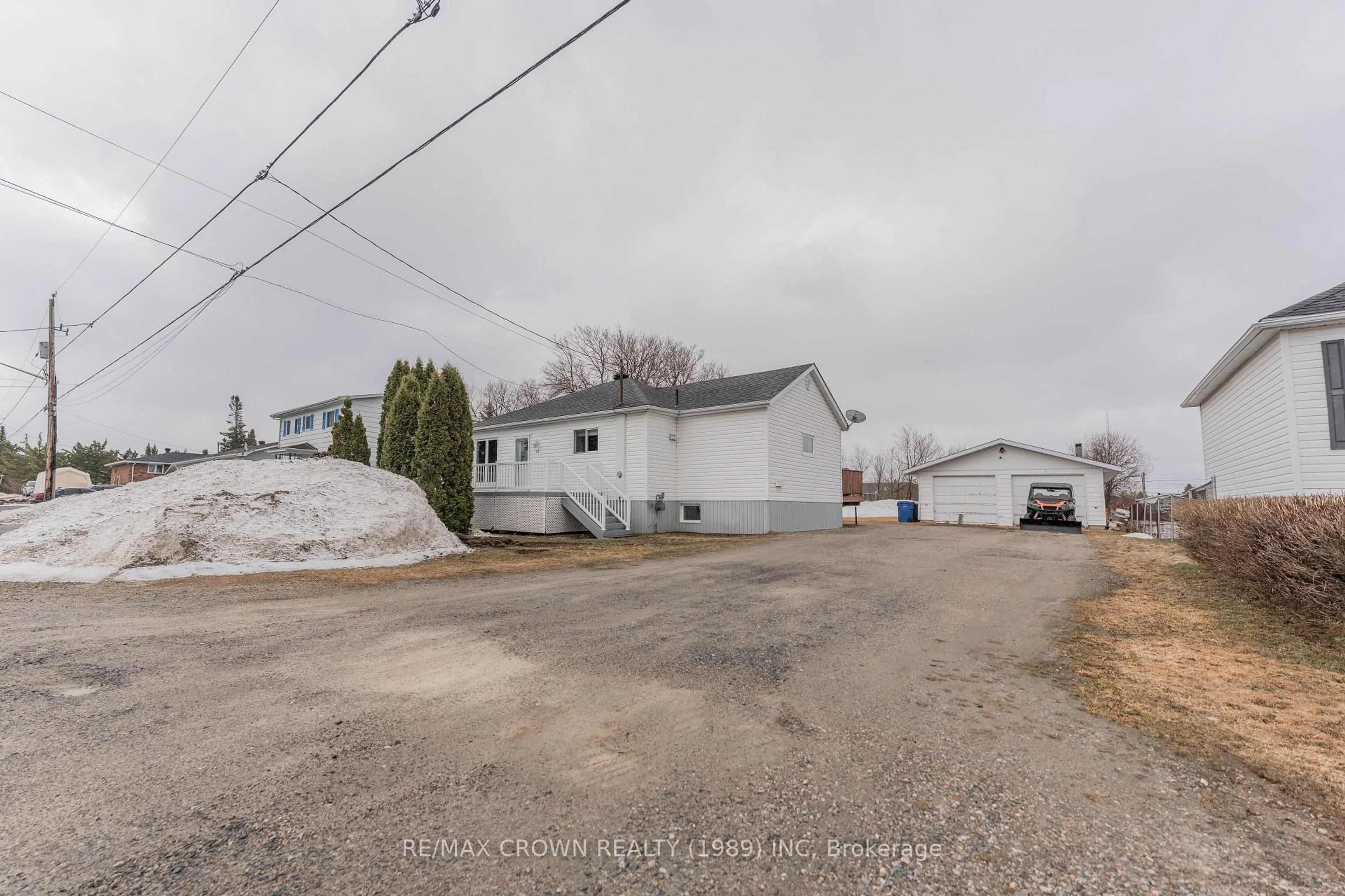 A pic from outside/outdoor area/front of a property/back of a property/a pic from drone, street for 43 De L'Etang Blvd, Kapuskasing Ontario P5N 2M6